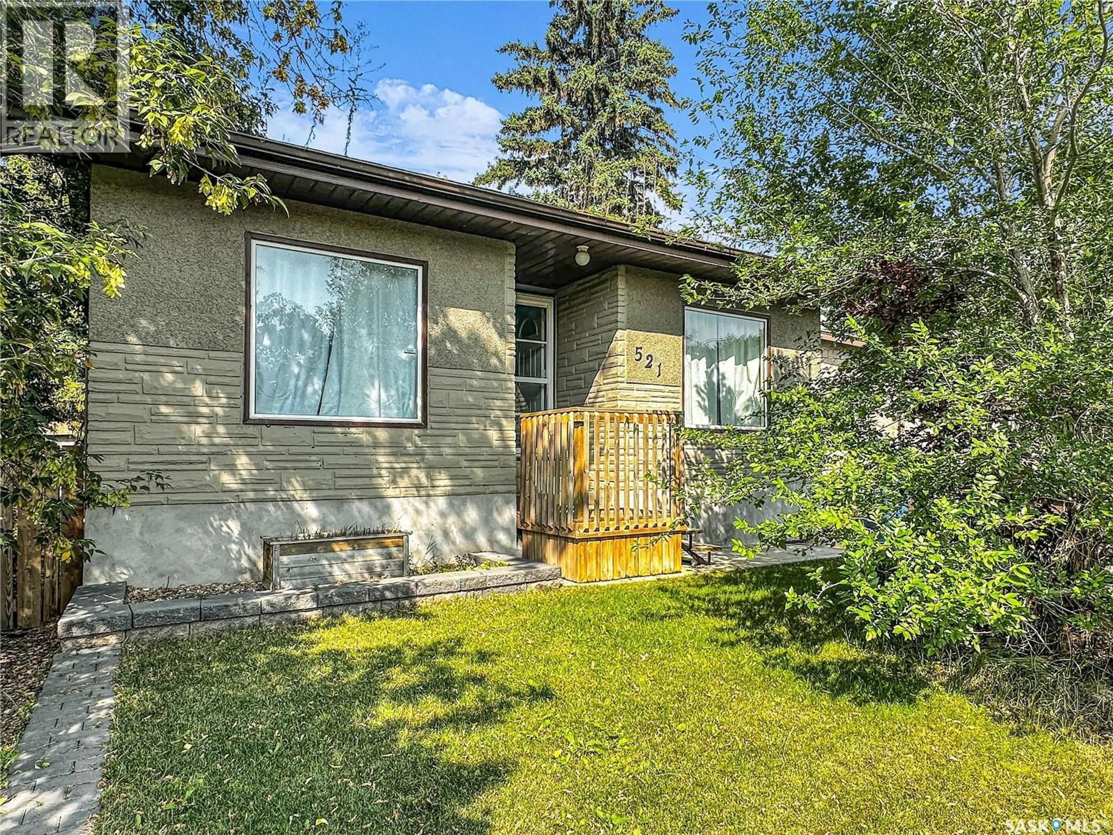 Home with vinyl exterior material, street for 521 103RD STREET, North Battleford Saskatchewan S9A1J6