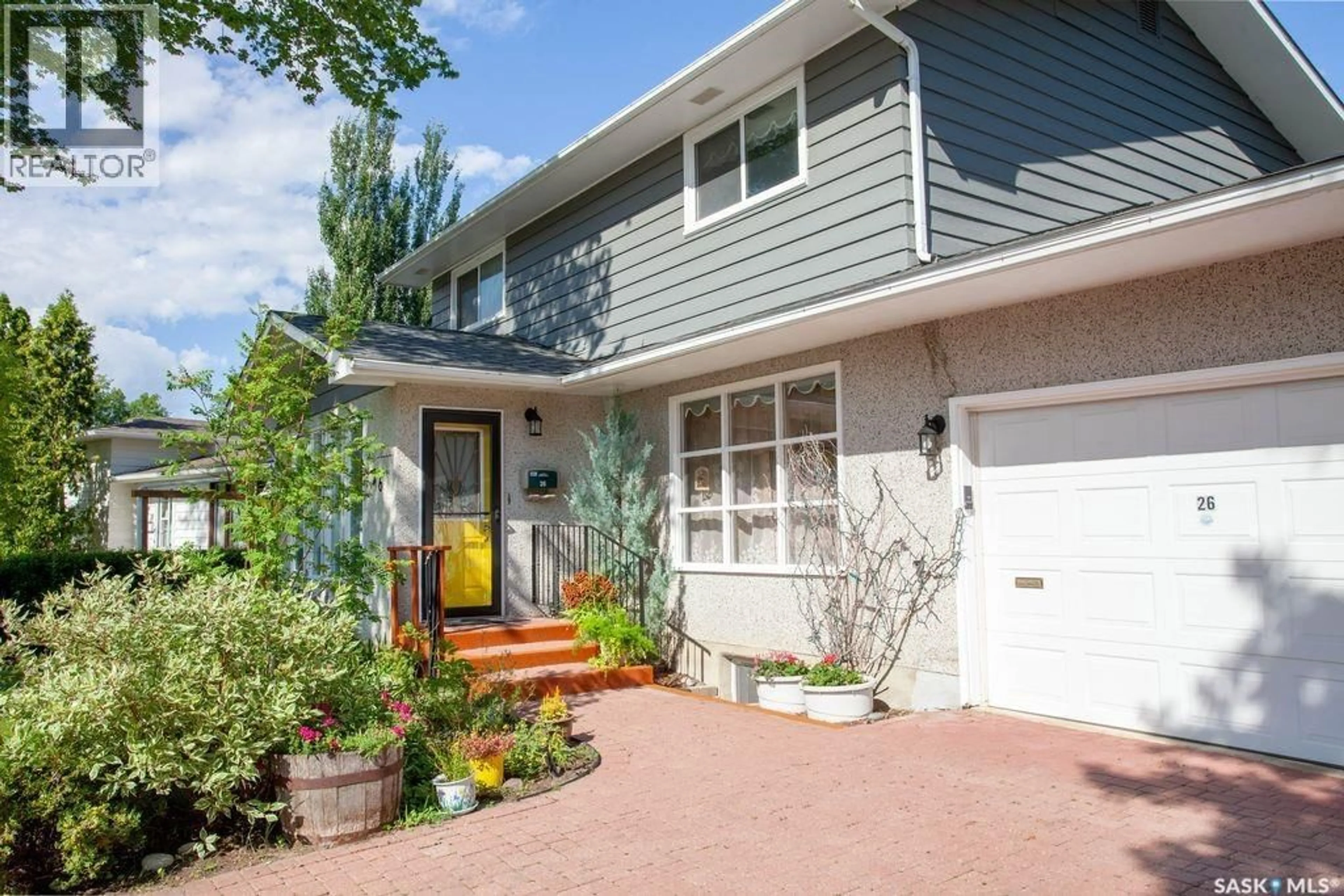 Home with vinyl exterior material, street for 26 RUTTER CRESCENT, Saskatoon Saskatchewan S7H3B7