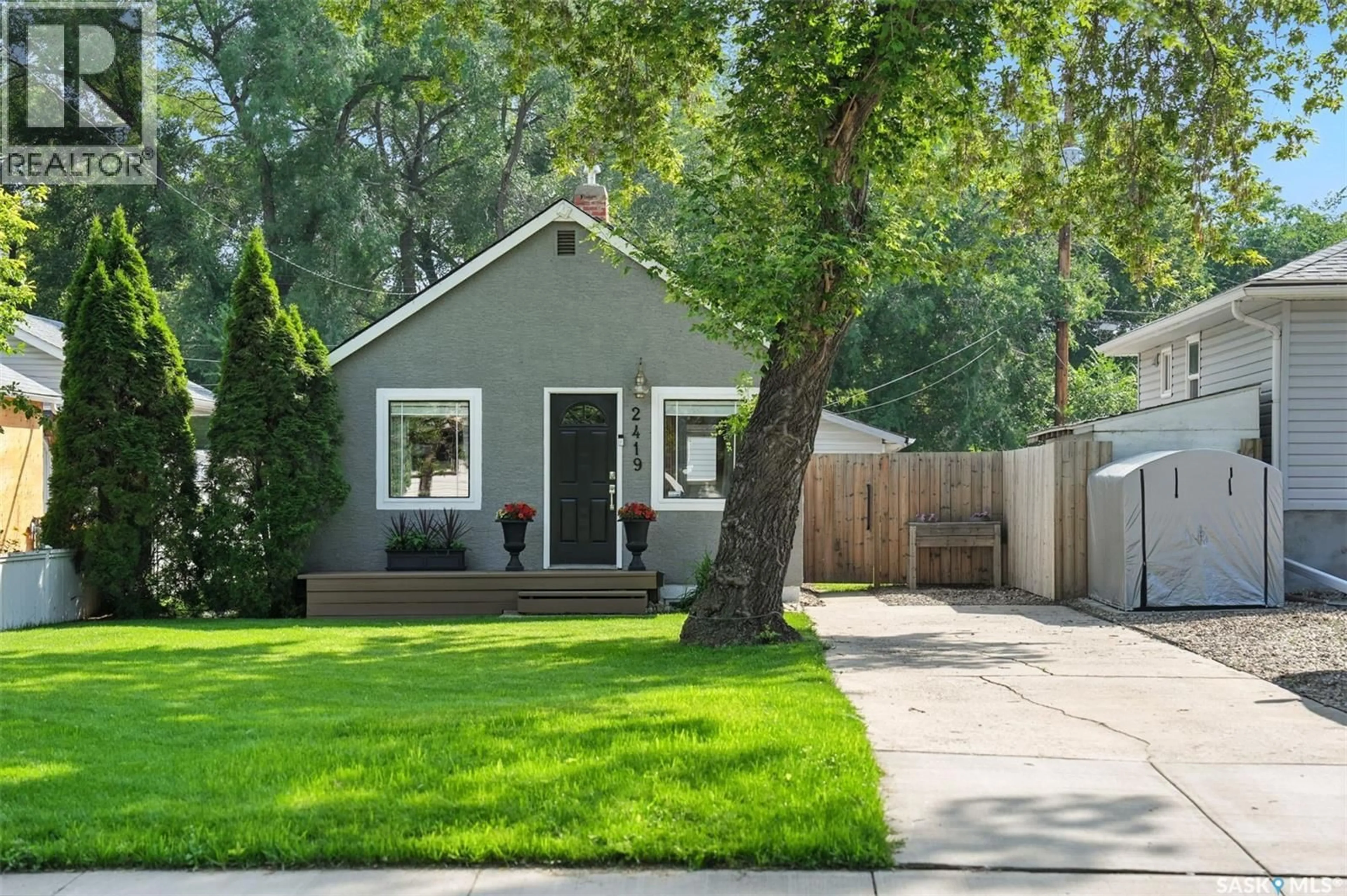 Home with vinyl exterior material, street for 2419 MCPHERSON AVENUE, Saskatoon Saskatchewan S7J0T1