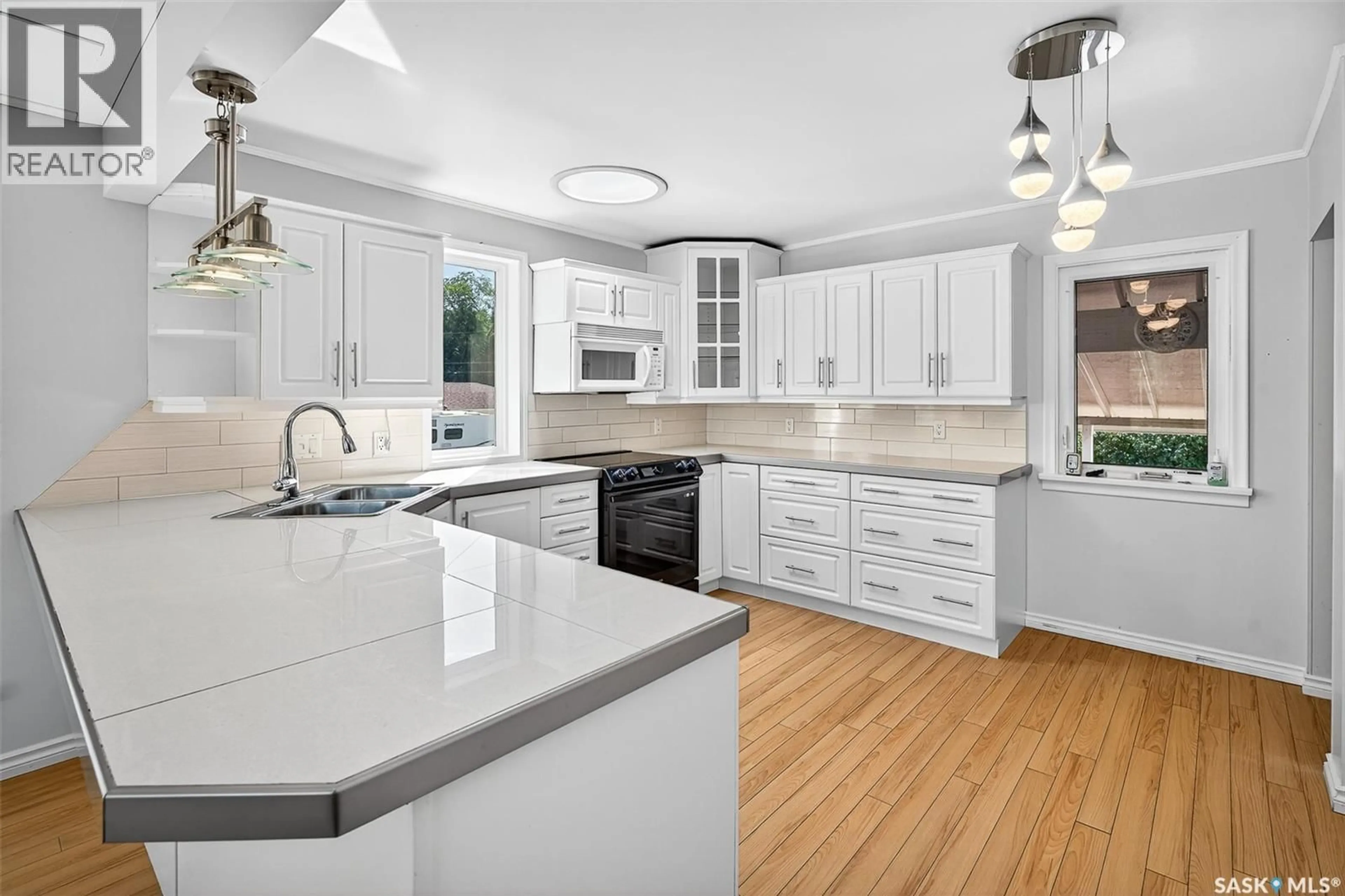 Open concept kitchen, ceramic/tile floor for 701 HOCHELAGA STREET, Moose Jaw Saskatchewan S6H2H5