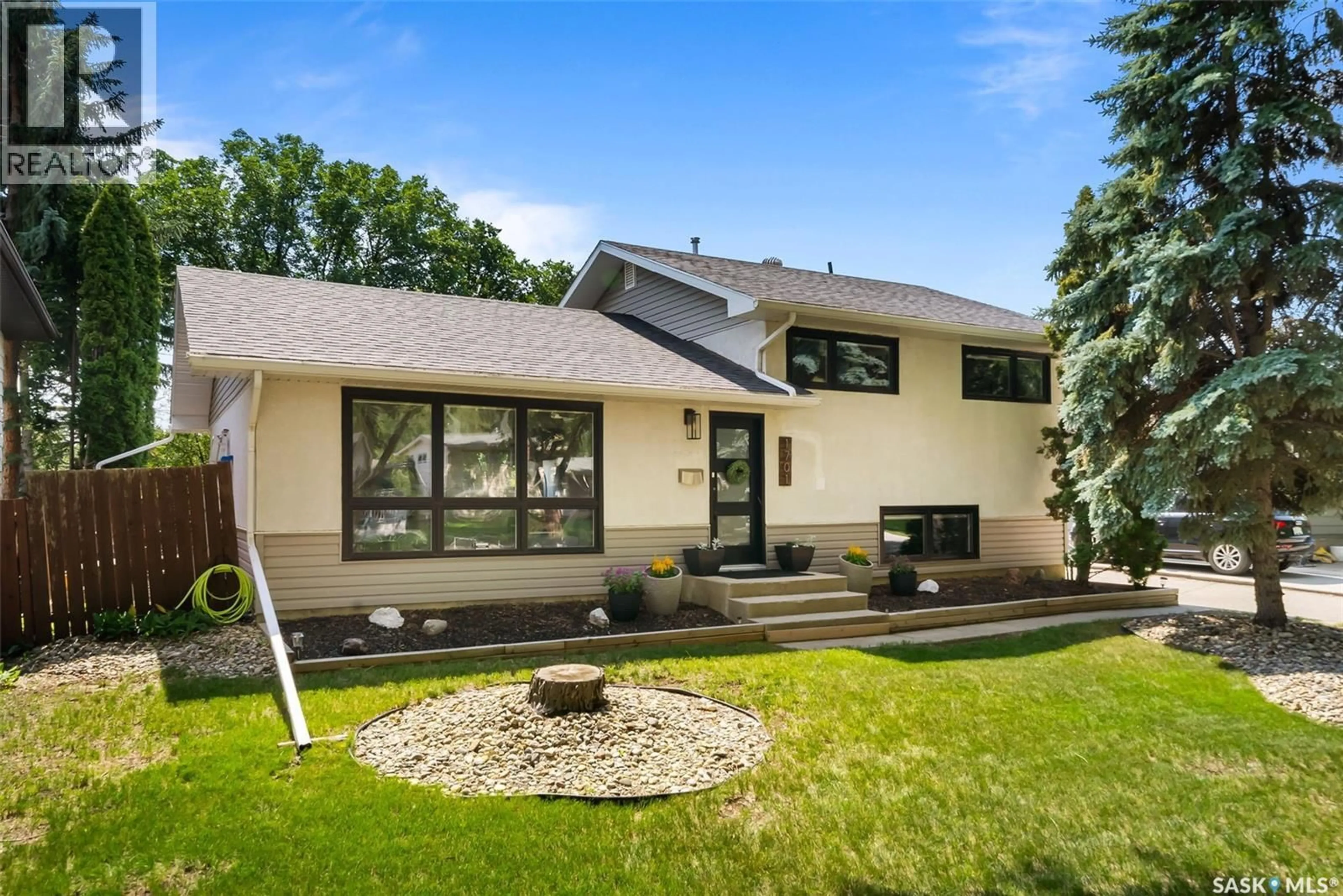 Home with vinyl exterior material, street for 1701 PARKER AVENUE, Regina Saskatchewan S4S4R9