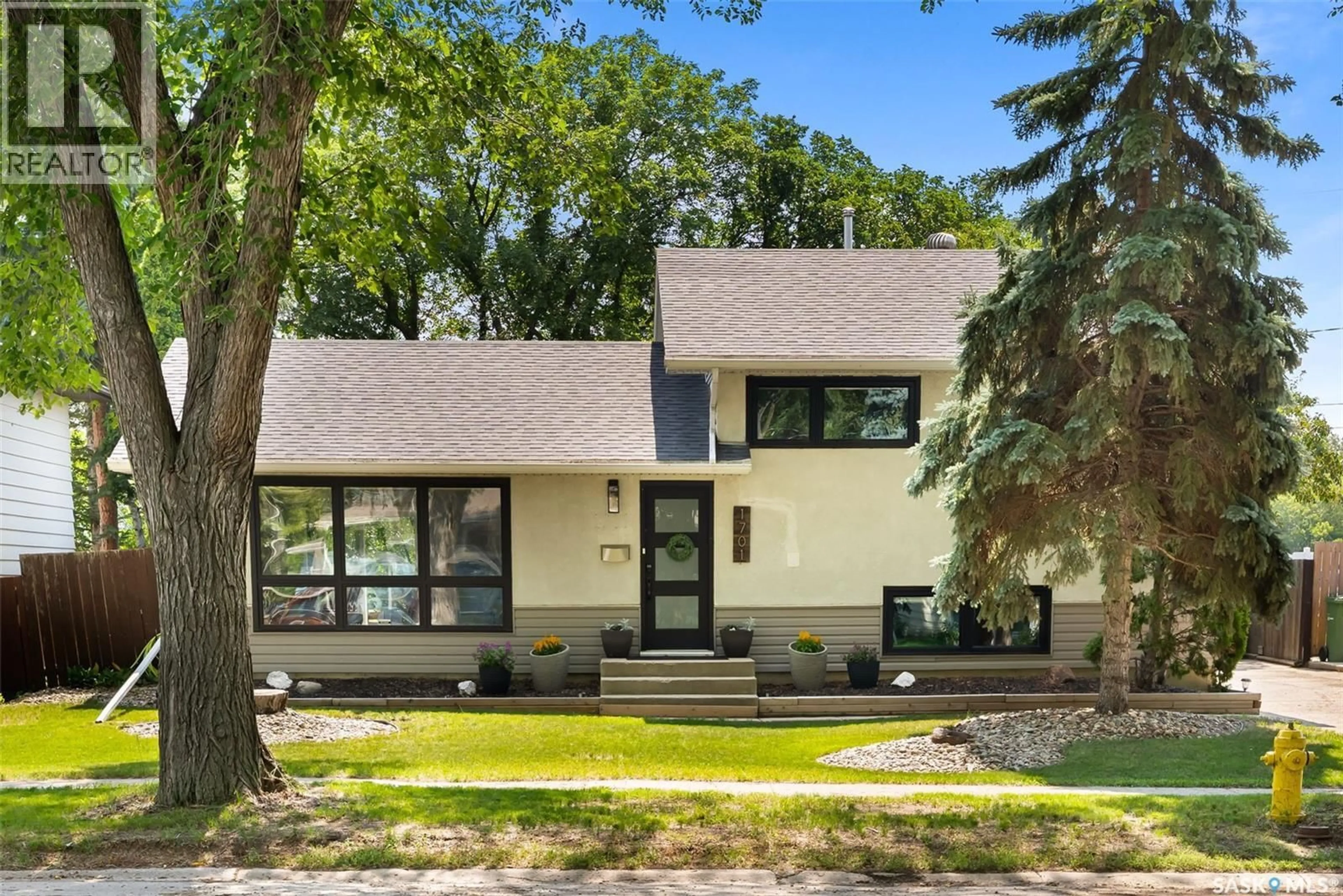 Home with brick exterior material, street for 1701 PARKER AVENUE, Regina Saskatchewan S4S4R9