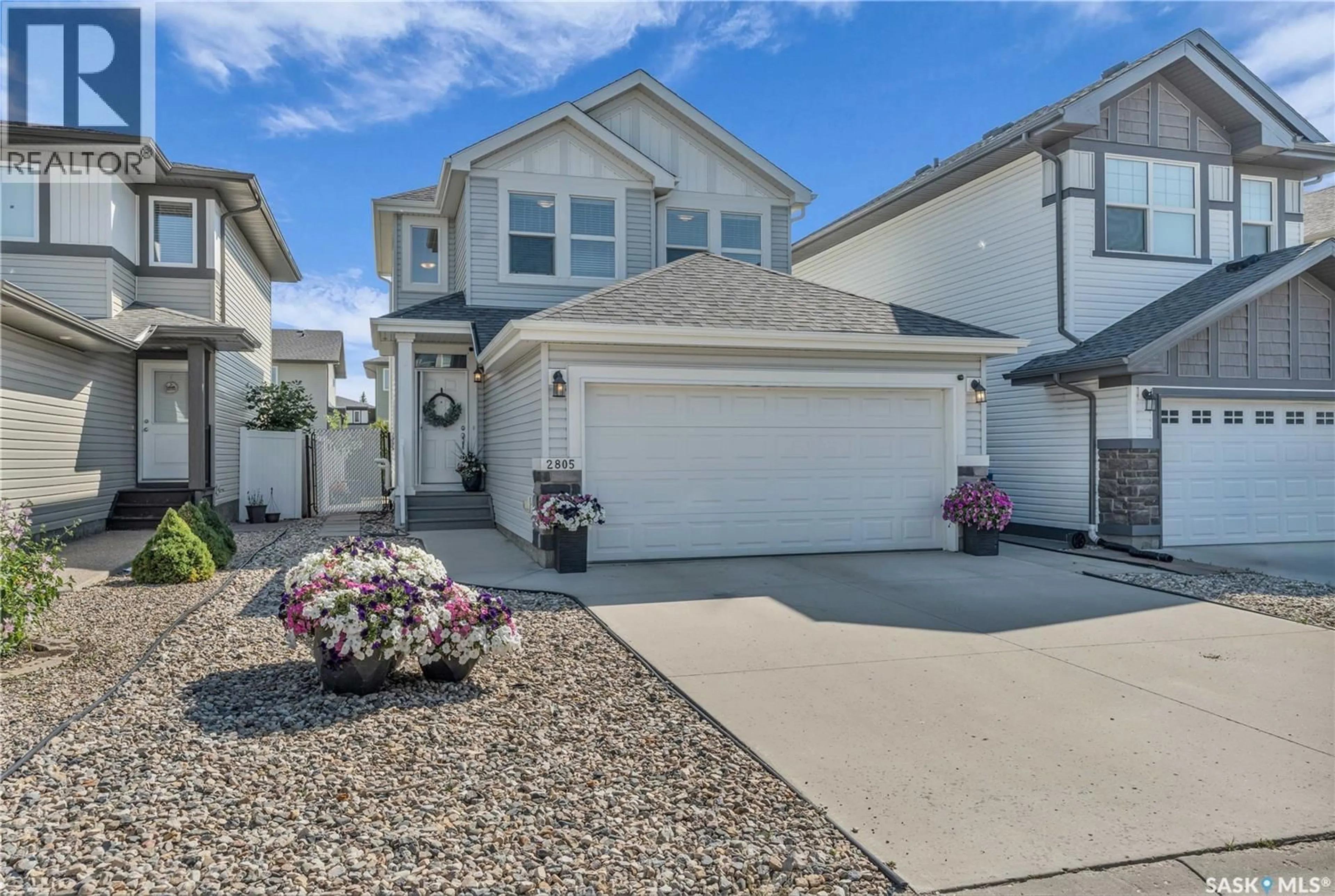 Home with vinyl exterior material, street for 2805 ELGAARD DRIVE, Regina Saskatchewan S4X0M5