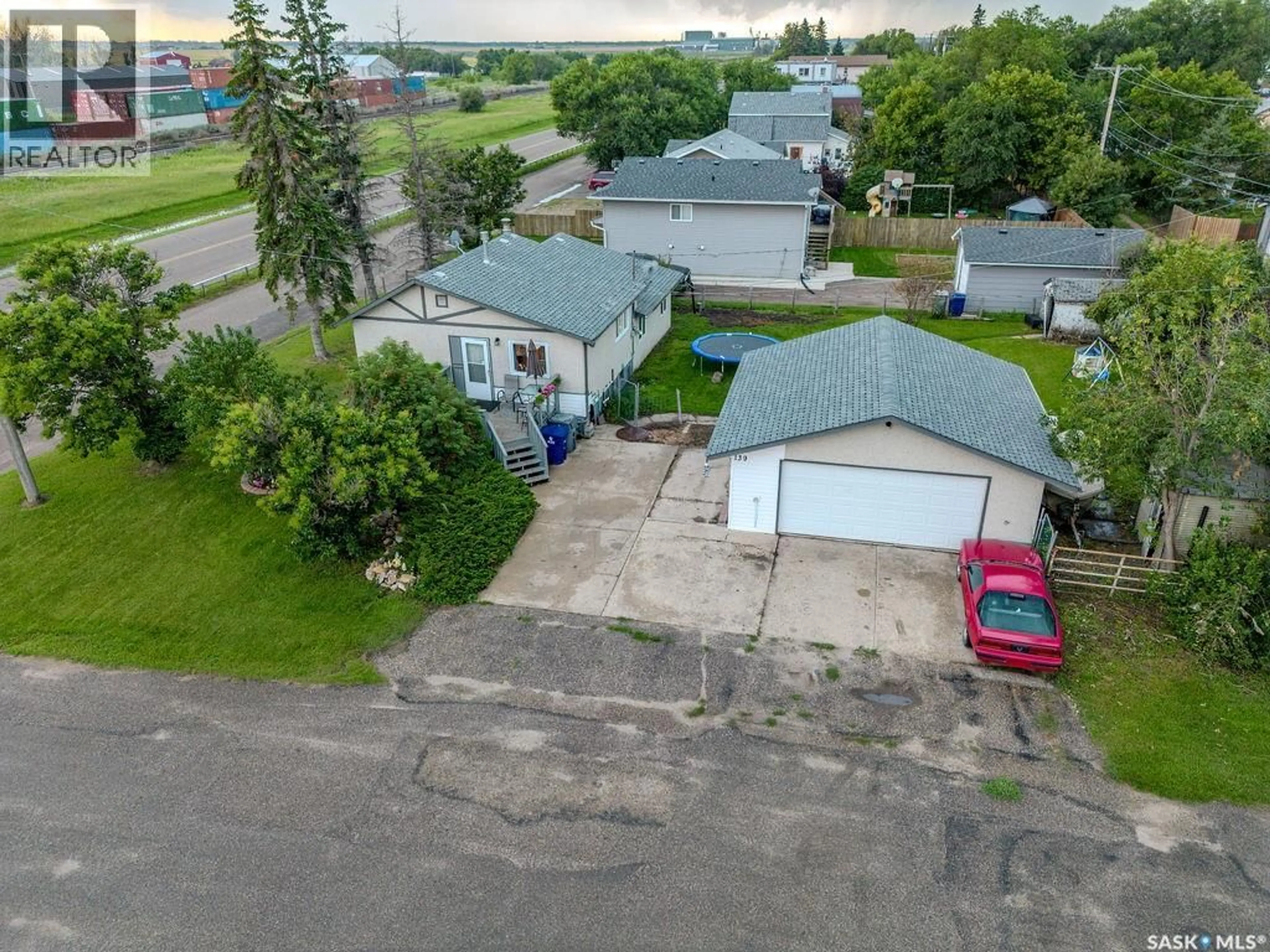 A pic from outside/outdoor area/front of a property/back of a property/a pic from drone, street for E - 139 S RAILWAY AVENUE, Vanscoy Saskatchewan S0L3J0