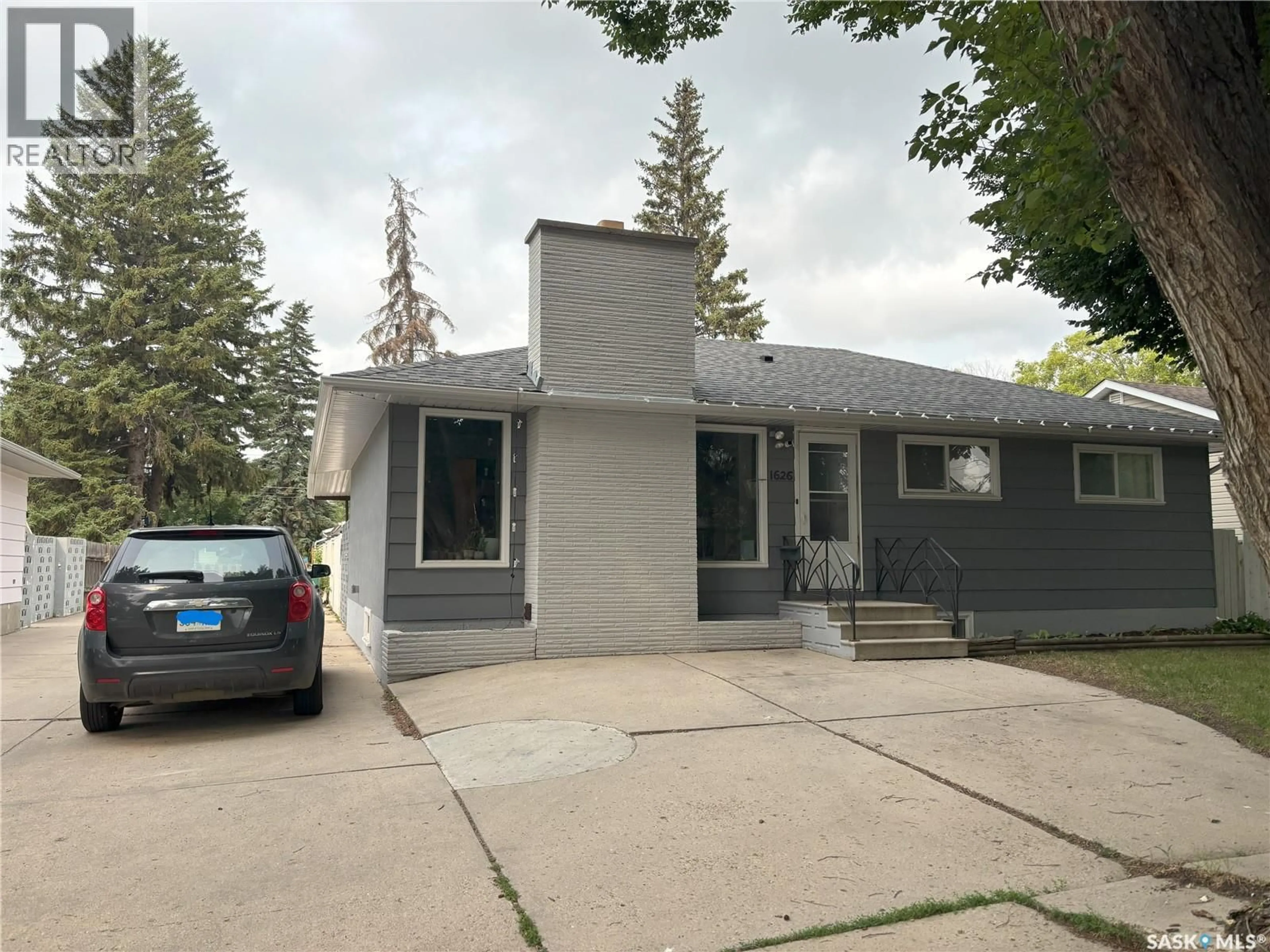 Home with vinyl exterior material, street for 1626 GROSVENOR AVENUE, Saskatoon Saskatchewan S0G4V0