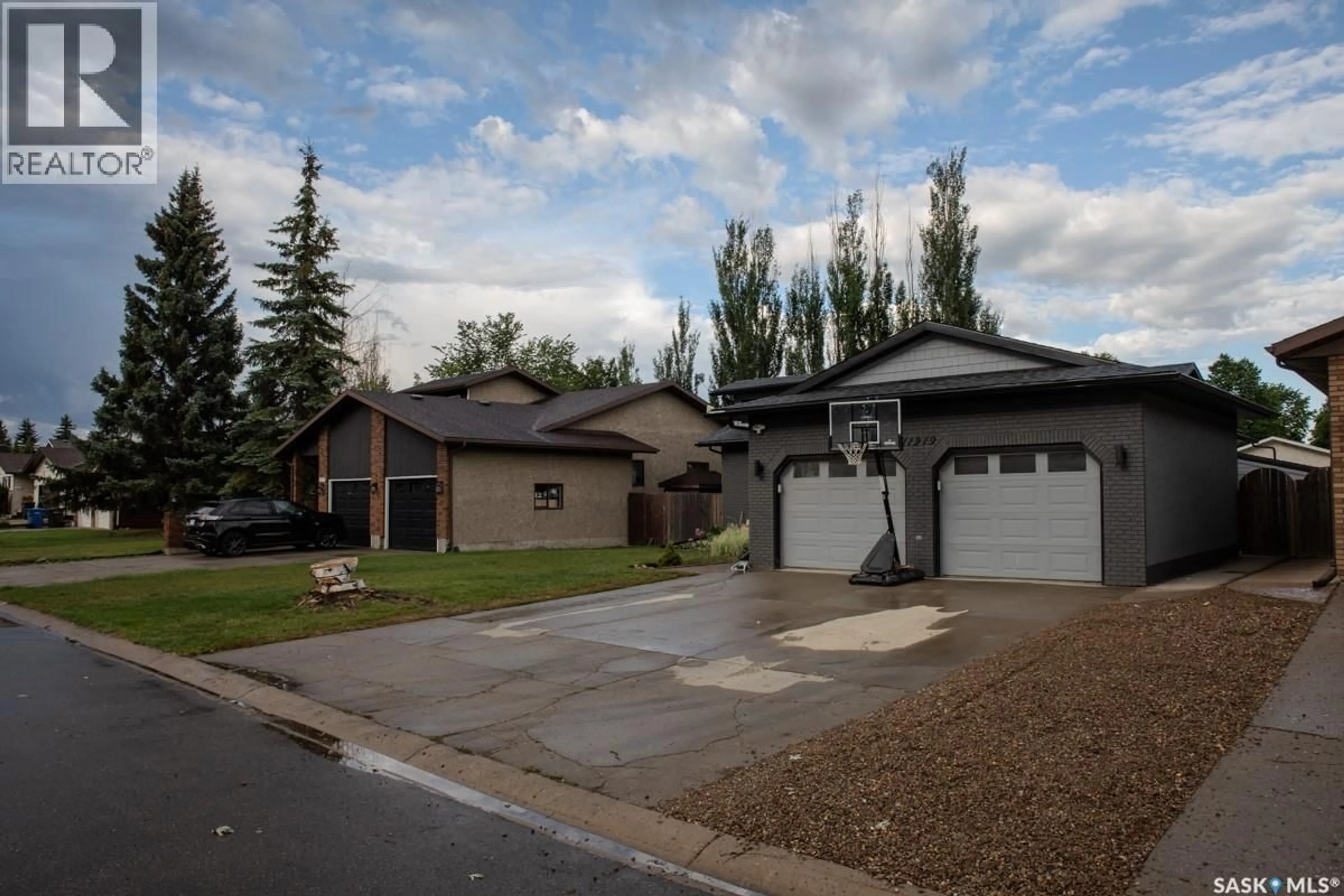 Home with vinyl exterior material, street for 11219 GARDINER DRIVE, North Battleford Saskatchewan S9A3M5
