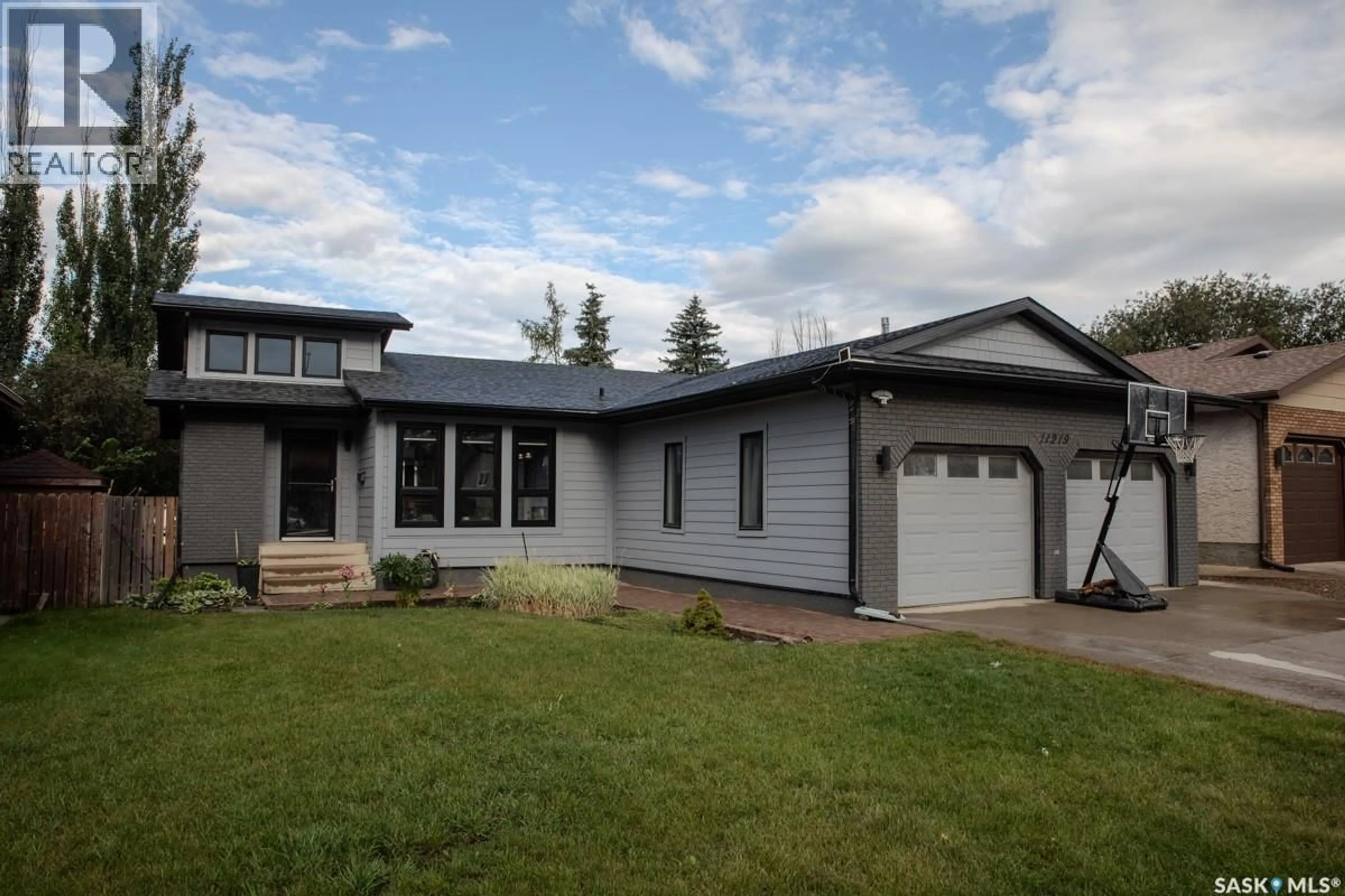 Home with vinyl exterior material, street for 11219 GARDINER DRIVE, North Battleford Saskatchewan S9A3M5