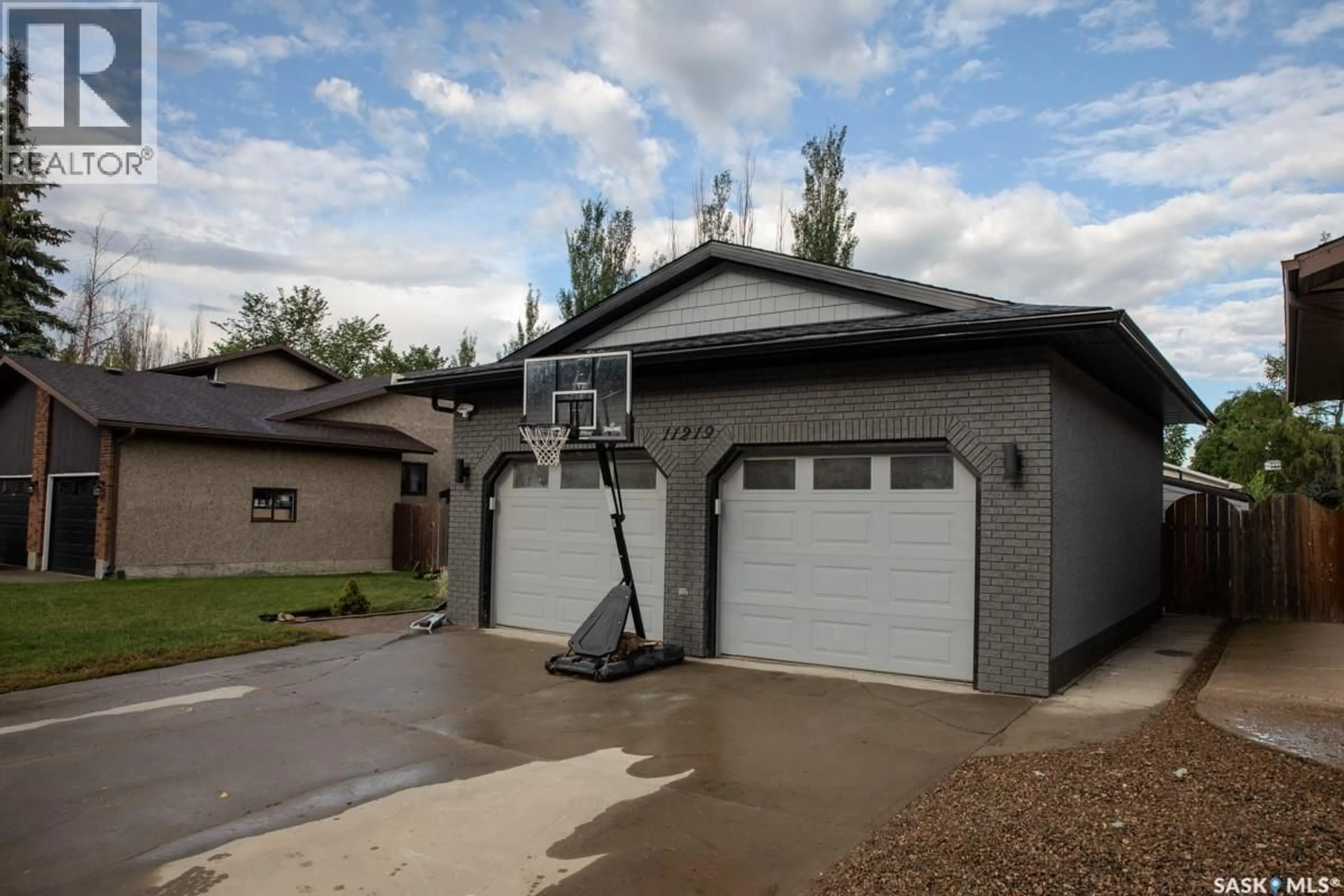 Home with vinyl exterior material, street for 11219 GARDINER DRIVE, North Battleford Saskatchewan S9A3M5