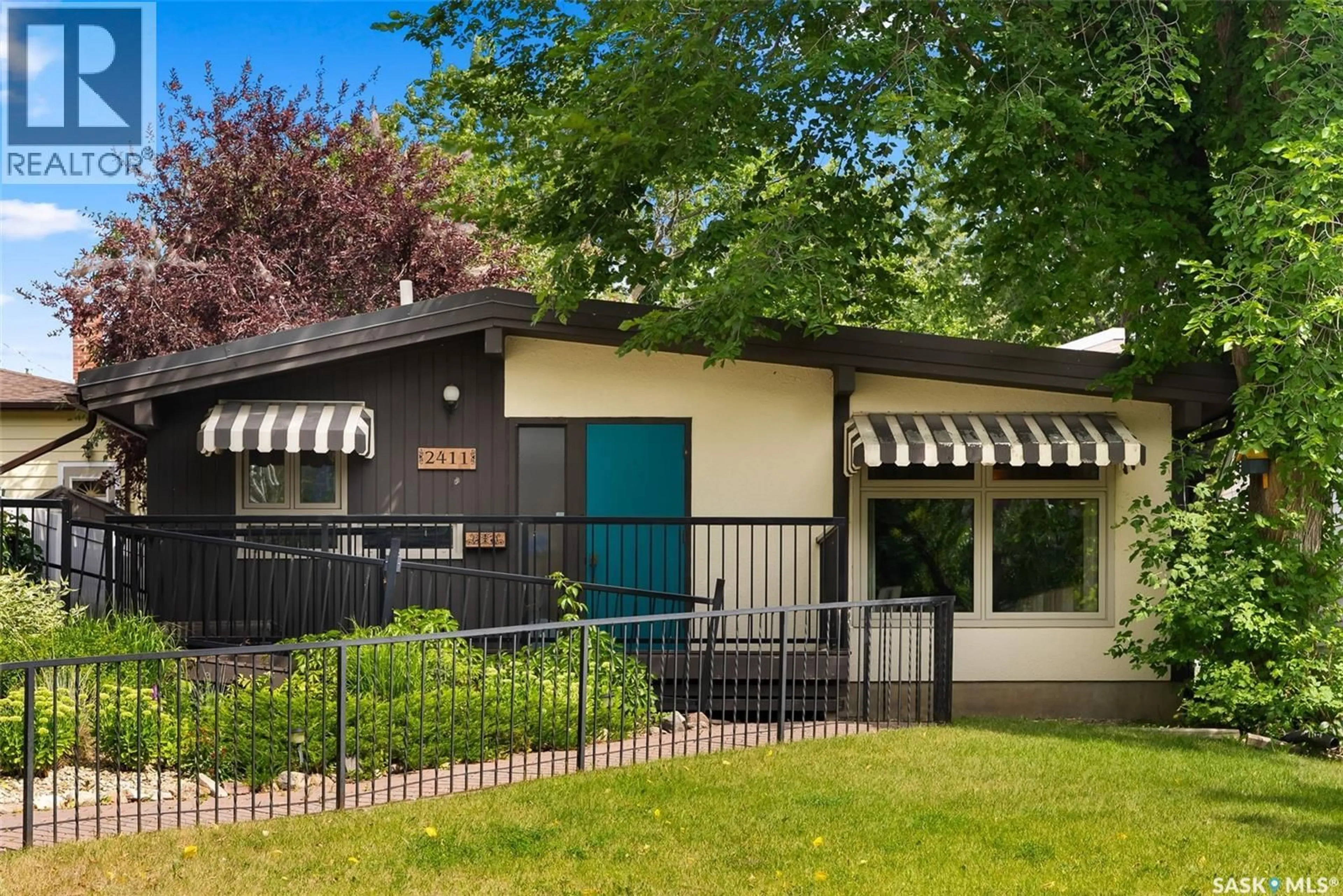 Home with vinyl exterior material, street for 2411 ATHOL STREET, Regina Saskatchewan S4T3G6