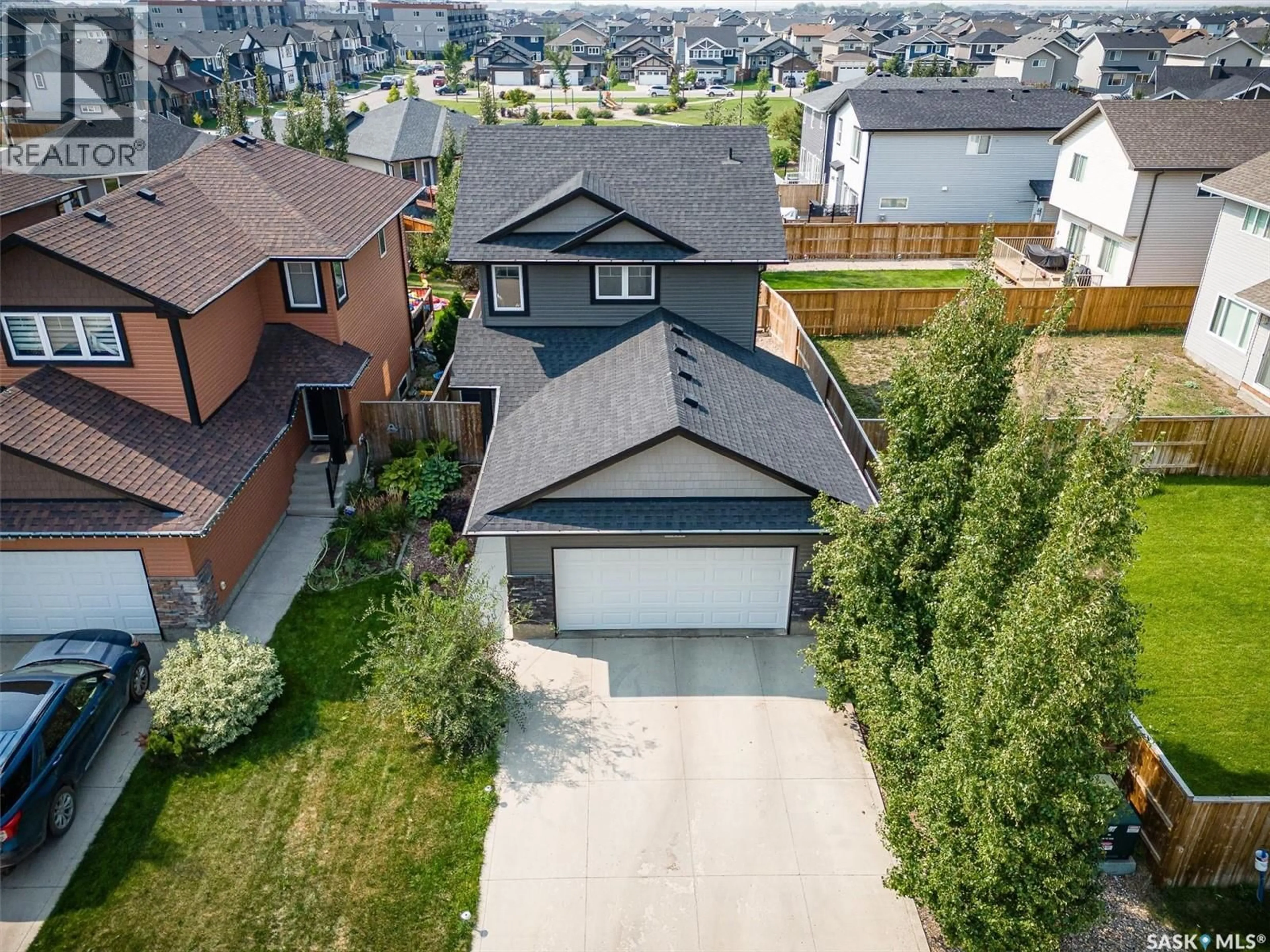A pic from outside/outdoor area/front of a property/back of a property/a pic from drone, street for 143 CHILDERS CRESCENT, Saskatoon Saskatchewan S7L3G4