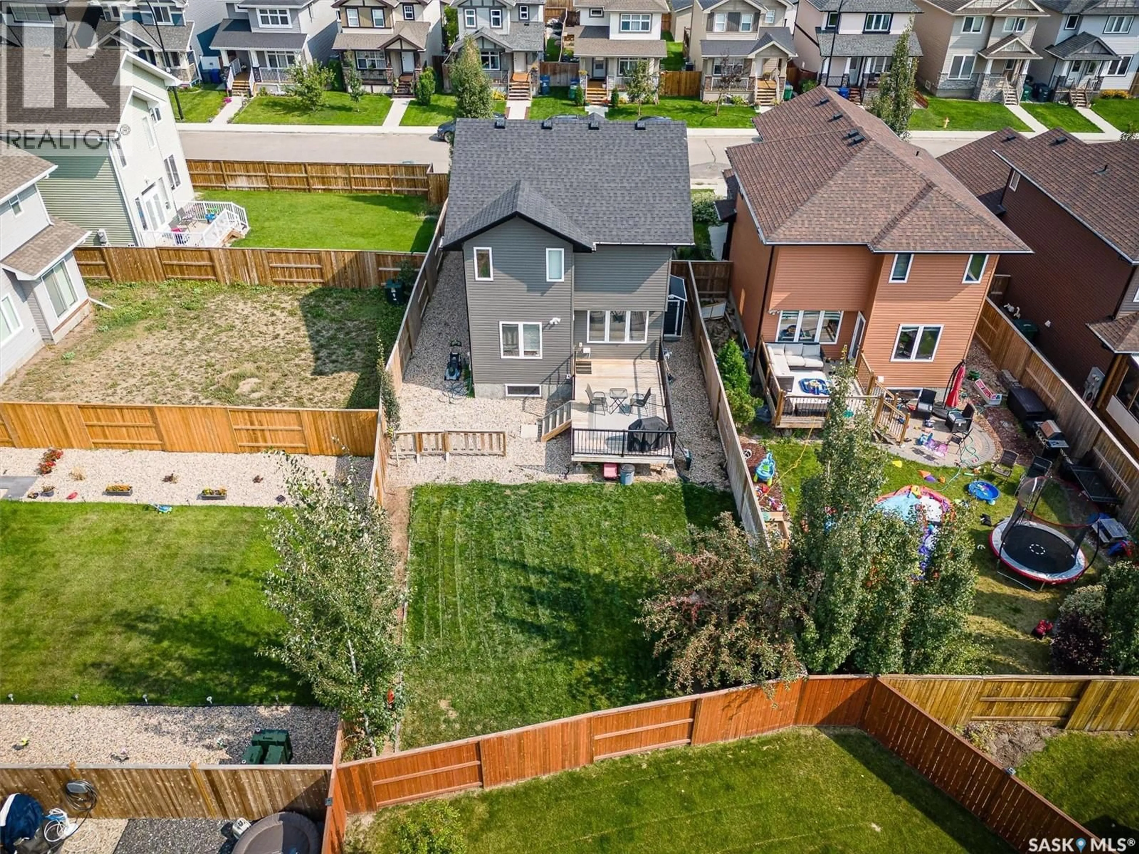 A pic from outside/outdoor area/front of a property/back of a property/a pic from drone, street for 143 CHILDERS CRESCENT, Saskatoon Saskatchewan S7L3G4