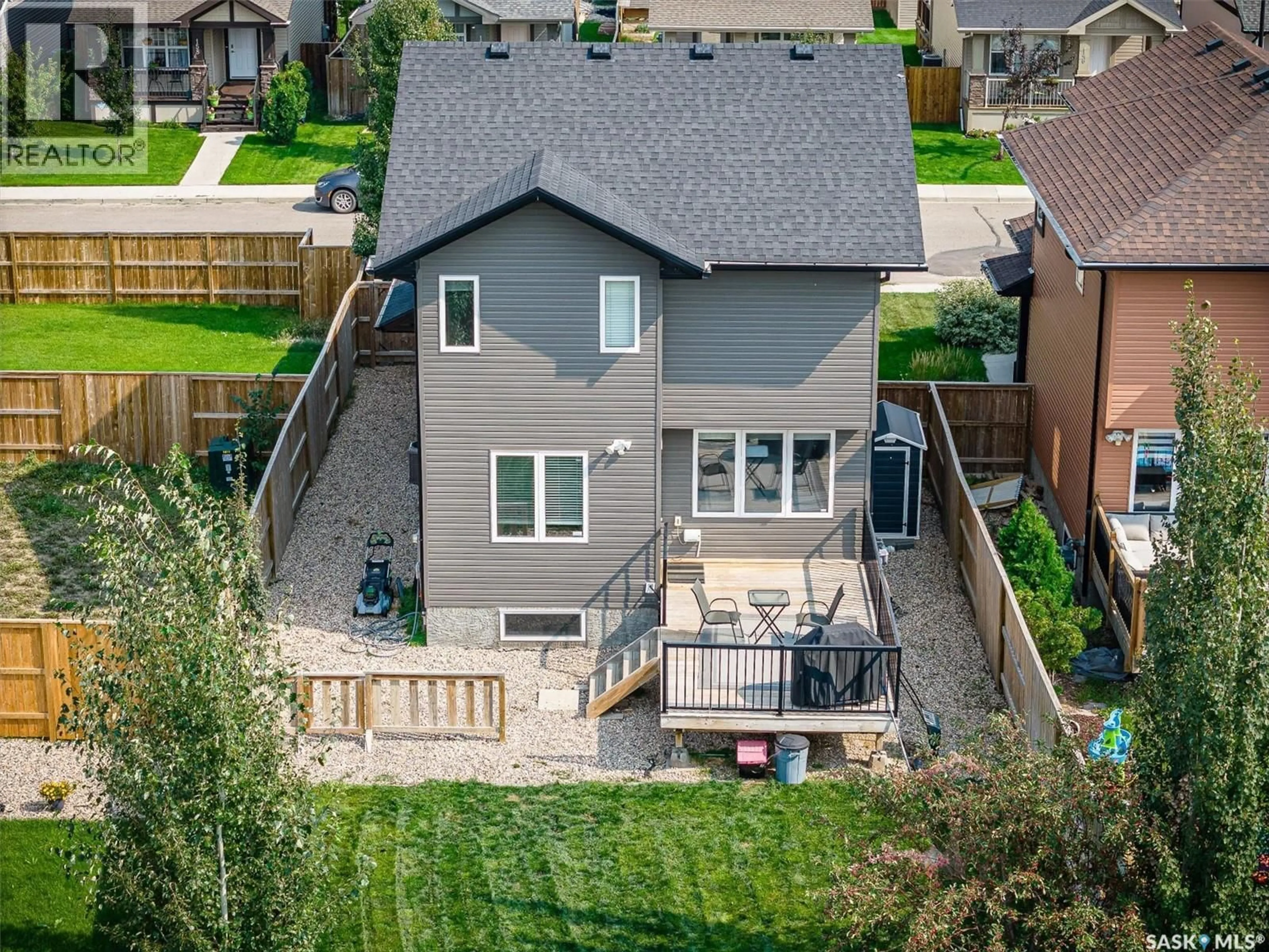 A pic from outside/outdoor area/front of a property/back of a property/a pic from drone, street for 143 CHILDERS CRESCENT, Saskatoon Saskatchewan S7L3G4