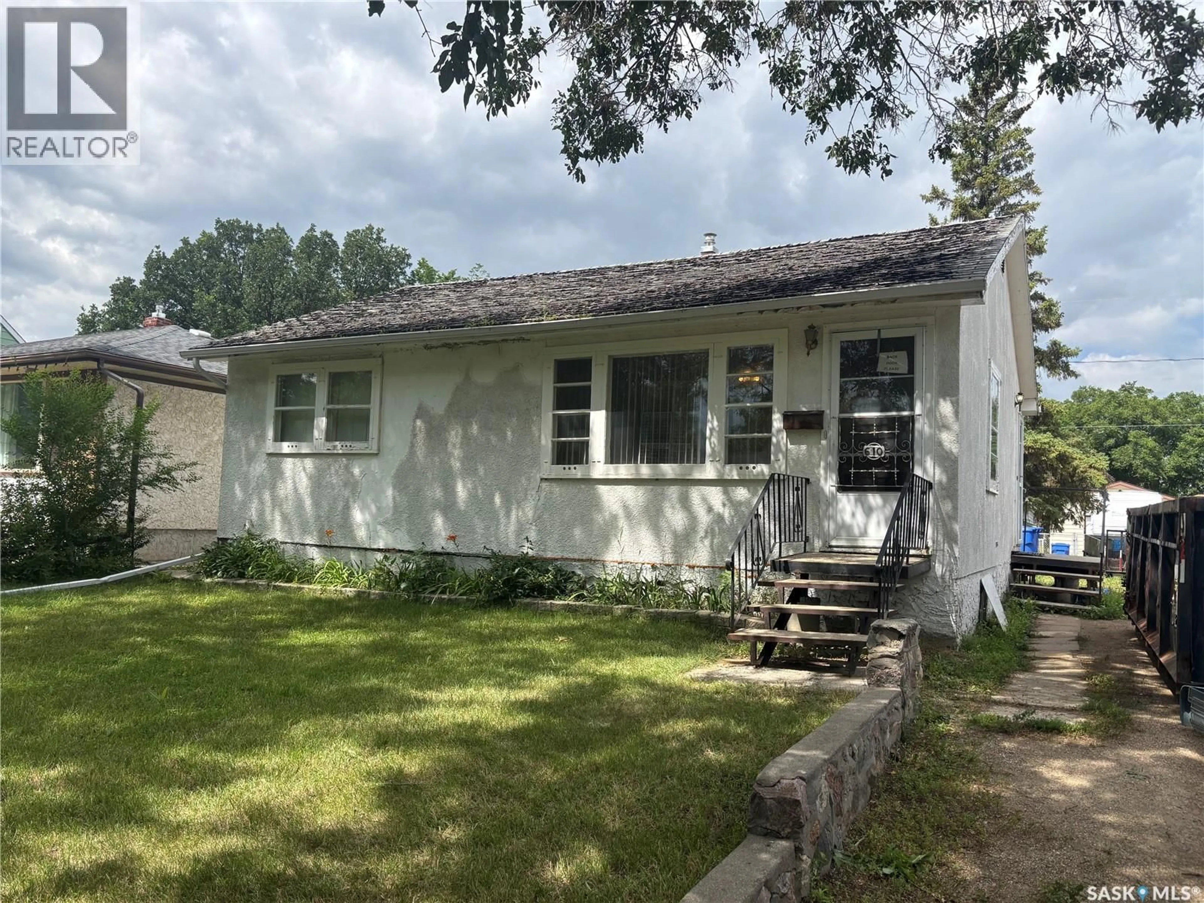 Home with vinyl exterior material, street for E - 610 MULLIN AVENUE, Regina Saskatchewan S4N1C9