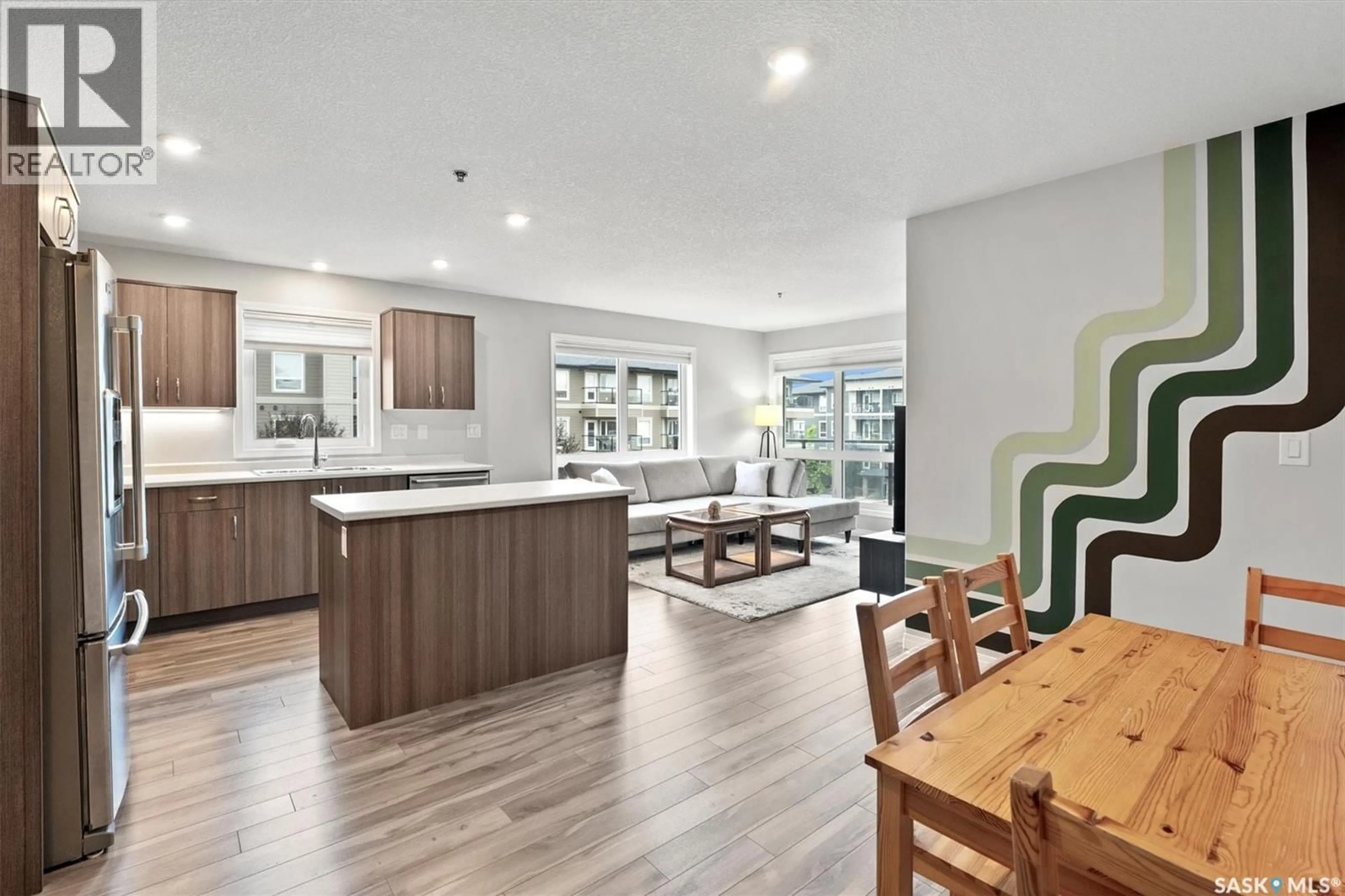 Open concept kitchen, wood/laminate floor for 4206 108 WILLIS CRESCENT, Saskatoon Saskatchewan S7T0W8
