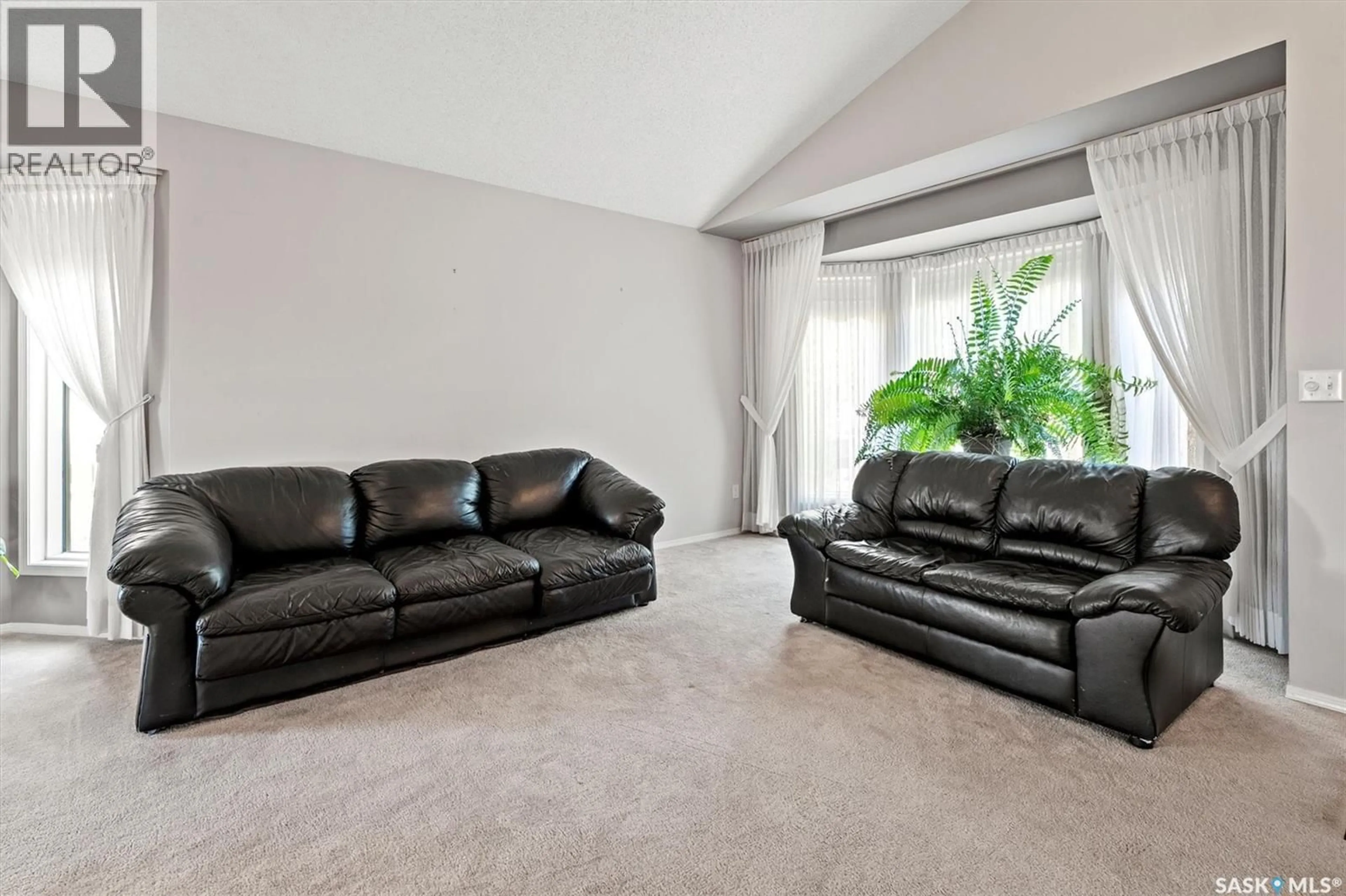 Living room with furniture, carpet floor for 222 HASLAM COURT, Saskatoon Saskatchewan S7S1E3