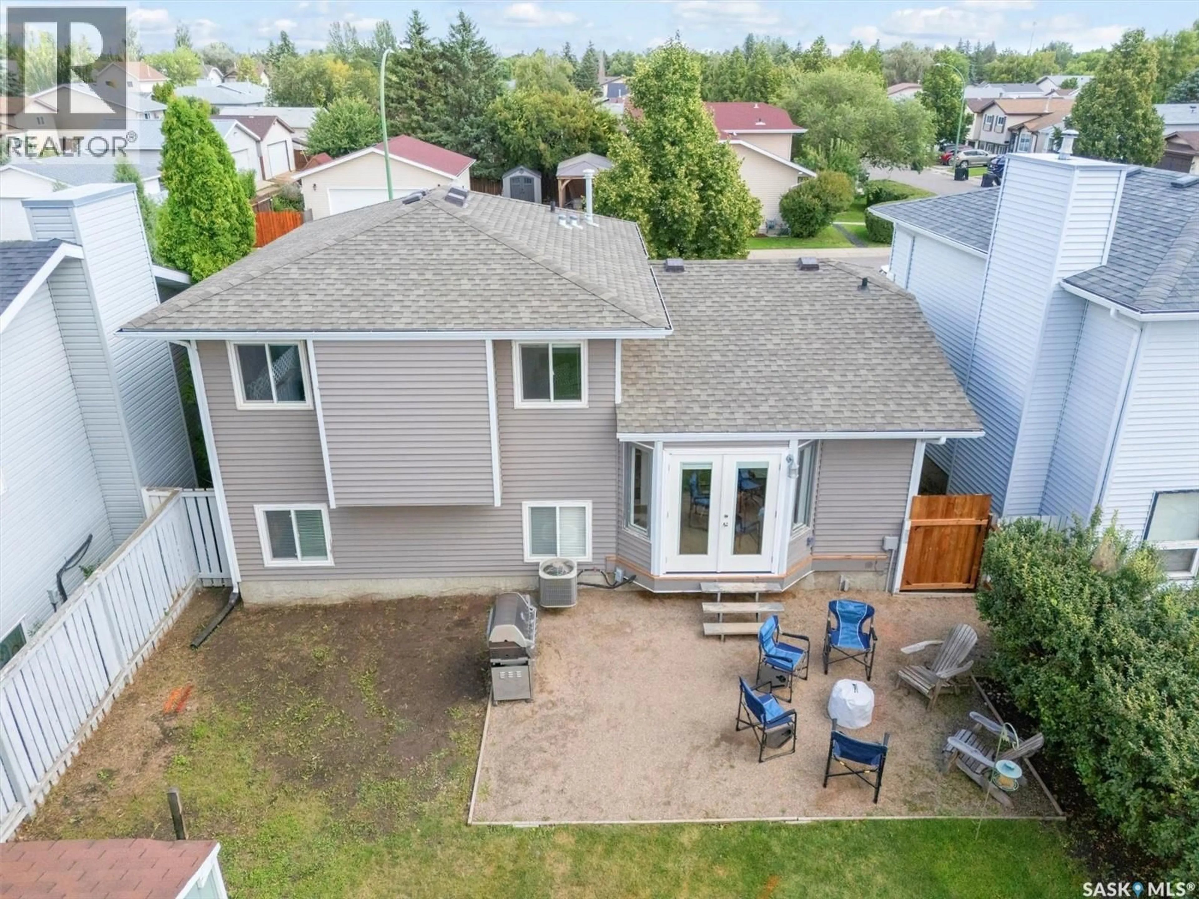 A pic from outside/outdoor area/front of a property/back of a property/a pic from drone, unknown for 215 CARTER CRESCENT, Saskatoon Saskatchewan S7L7K4