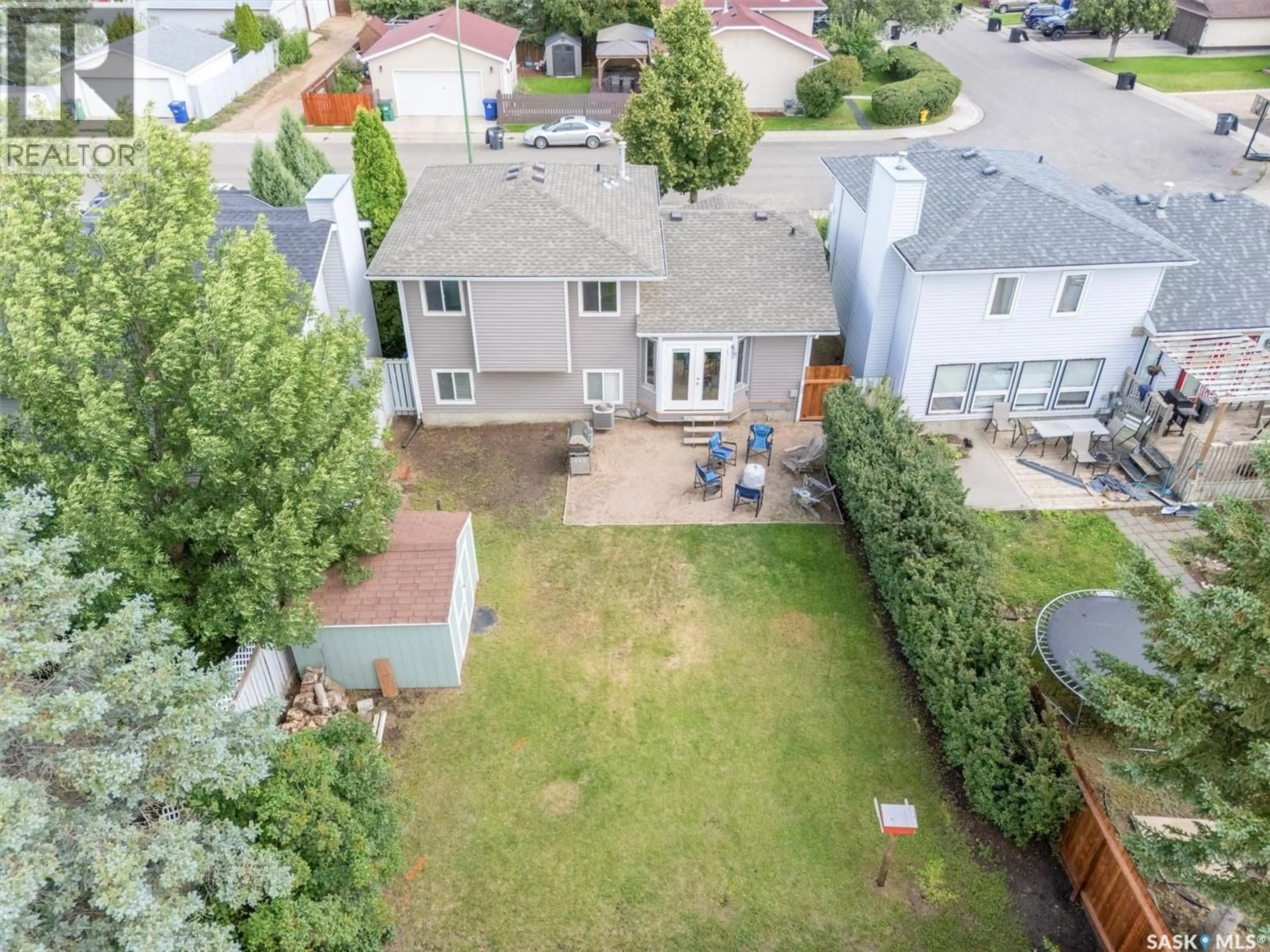A pic from outside/outdoor area/front of a property/back of a property/a pic from drone, unknown for 215 CARTER CRESCENT, Saskatoon Saskatchewan S7L7K4