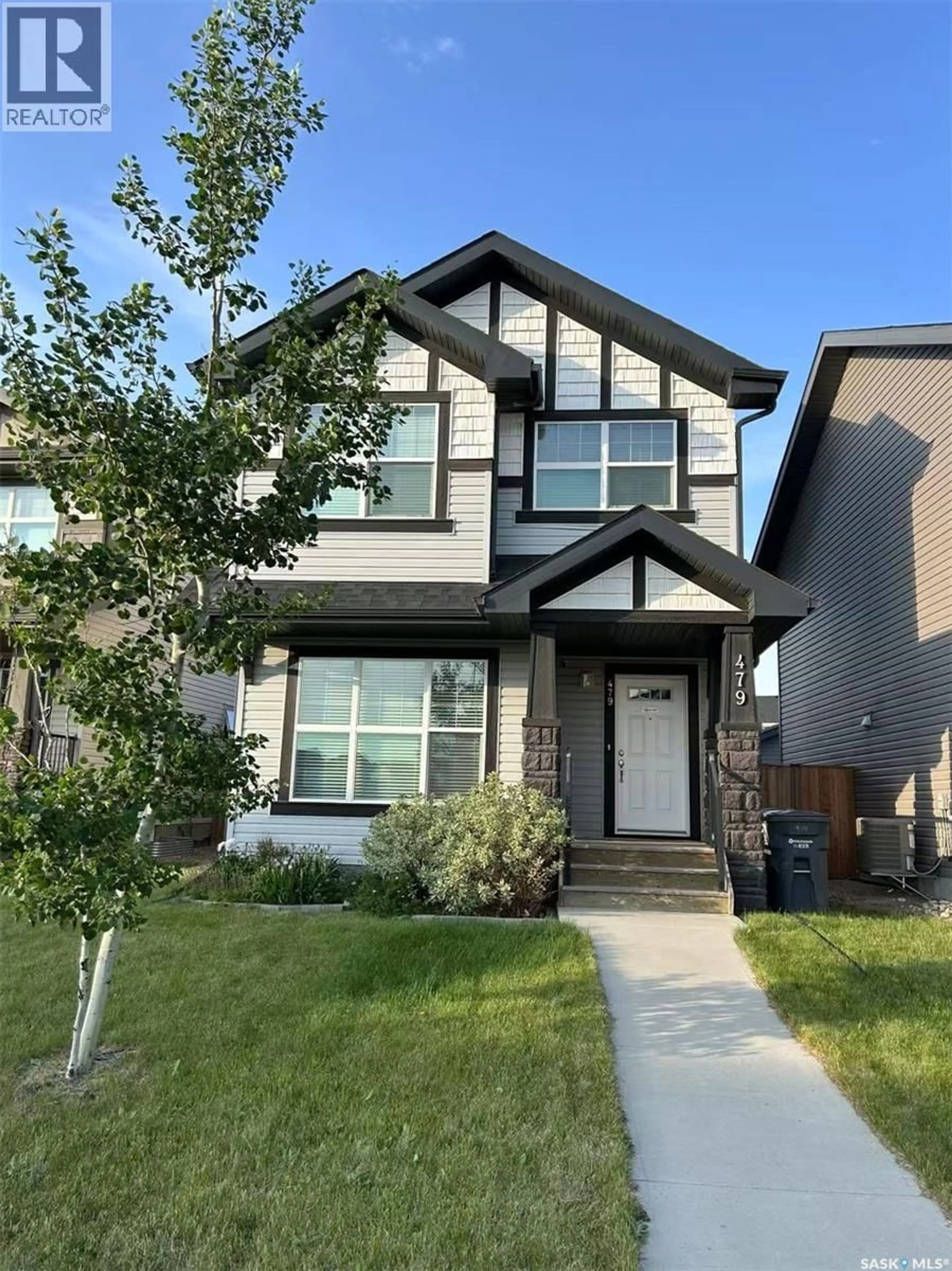 Home with vinyl exterior material, street for 479 SECORD WAY, Saskatoon Saskatchewan S7V0N9