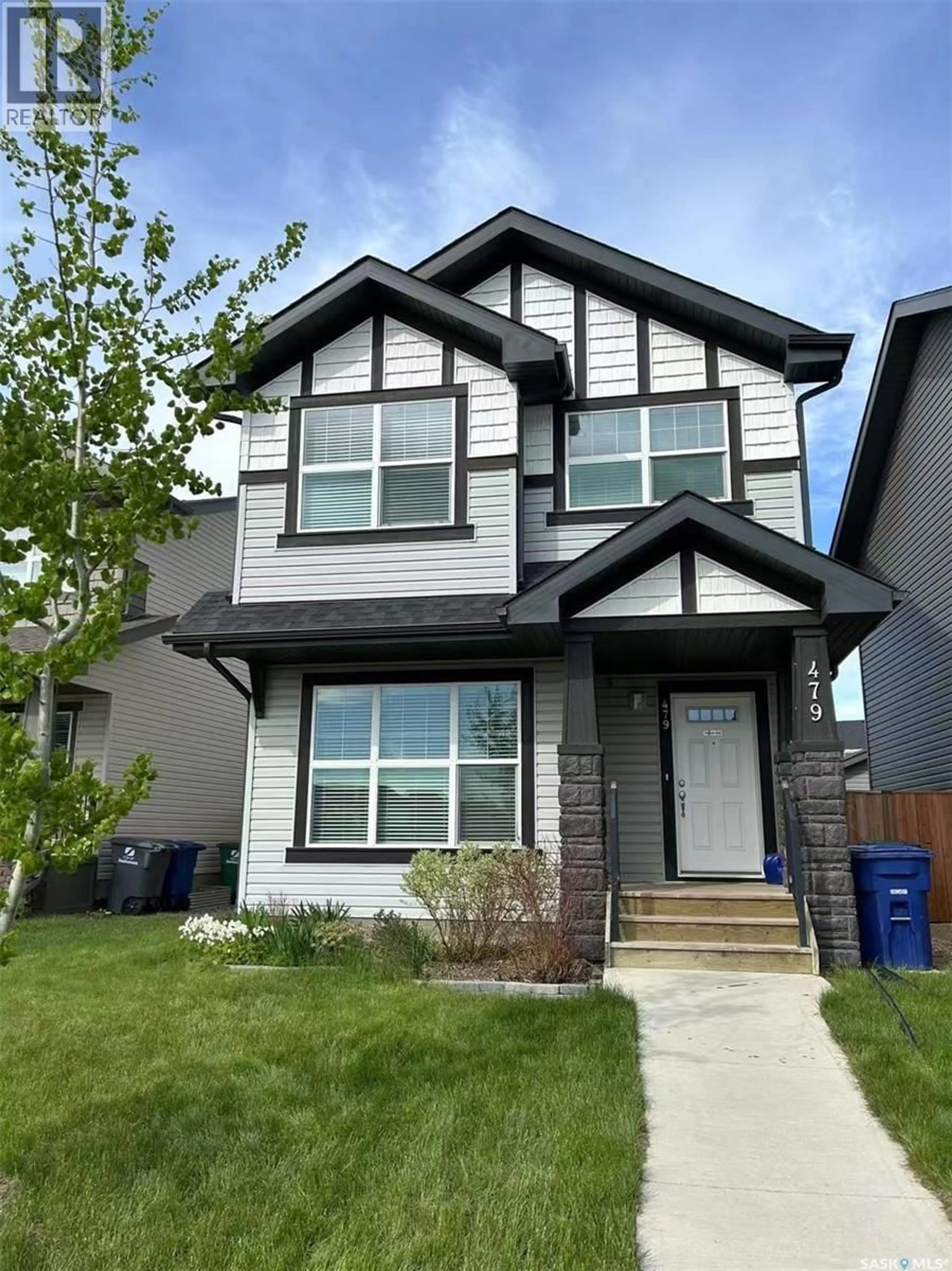 Home with vinyl exterior material, street for 479 SECORD WAY, Saskatoon Saskatchewan S7V0N9