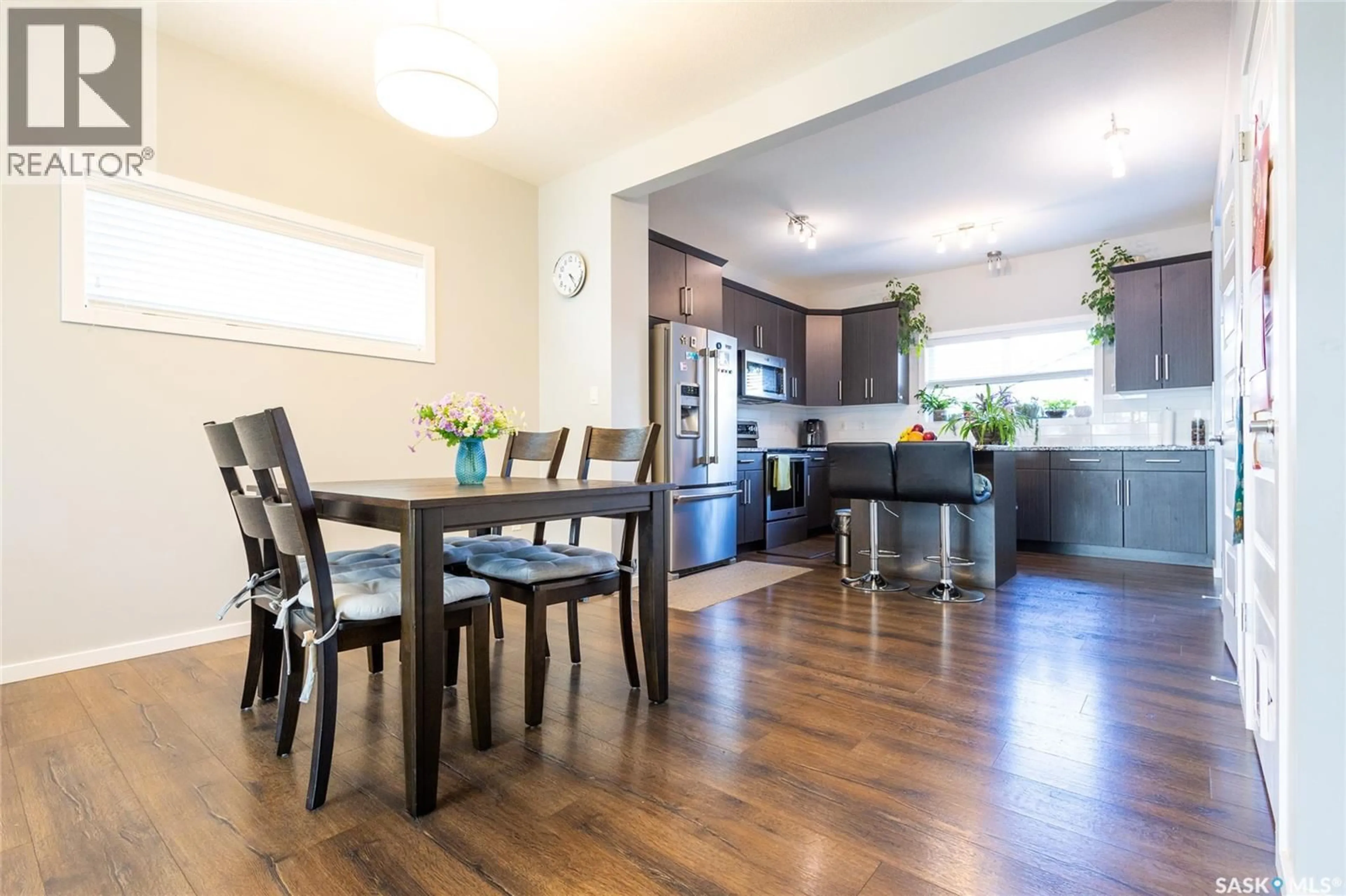 Open concept kitchen, wood/laminate floor for 479 SECORD WAY, Saskatoon Saskatchewan S7V0N9
