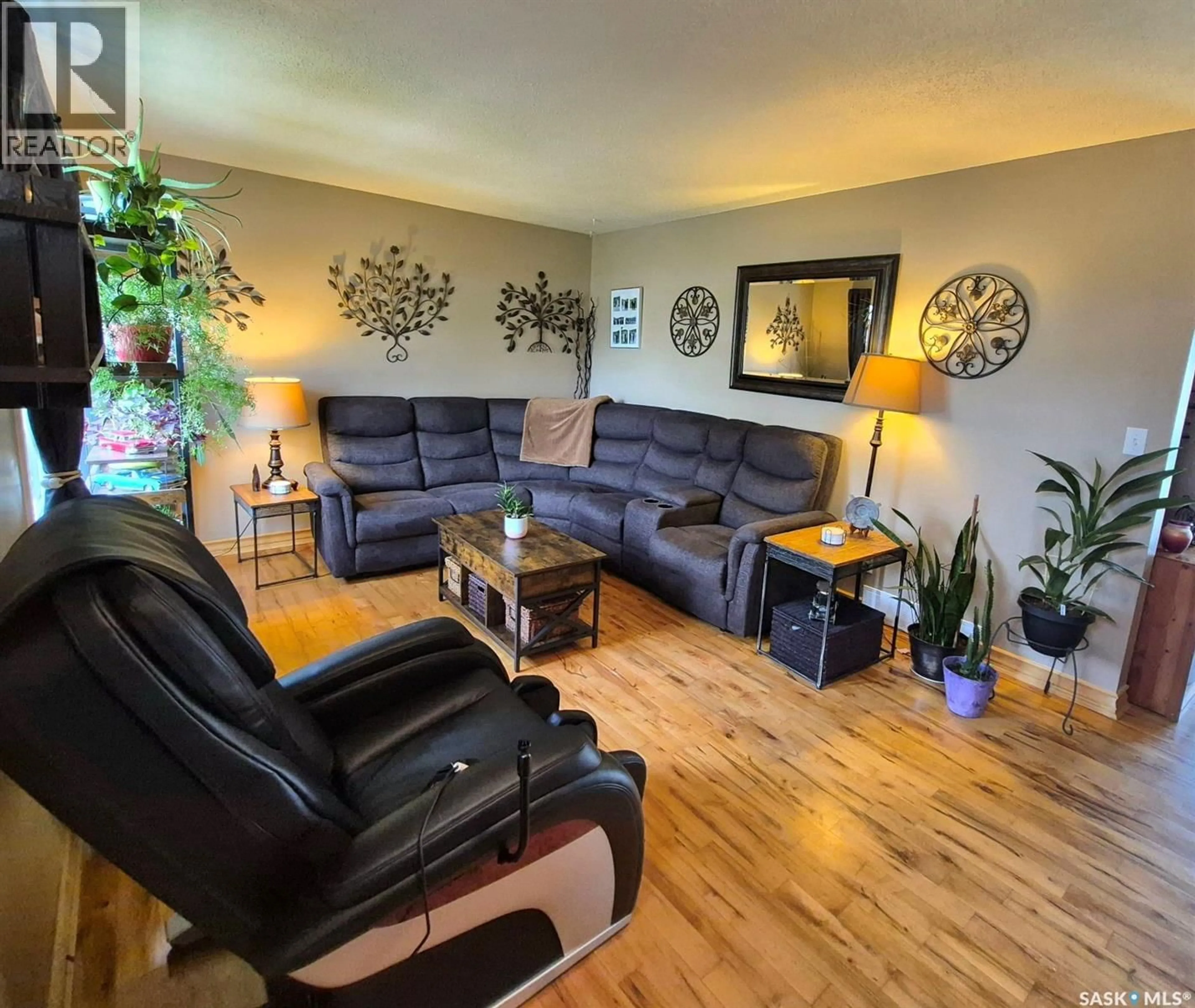 Living room with furniture, wood/laminate floor for 1443 4TH STREET, Prince Albert Saskatchewan S6V0L7
