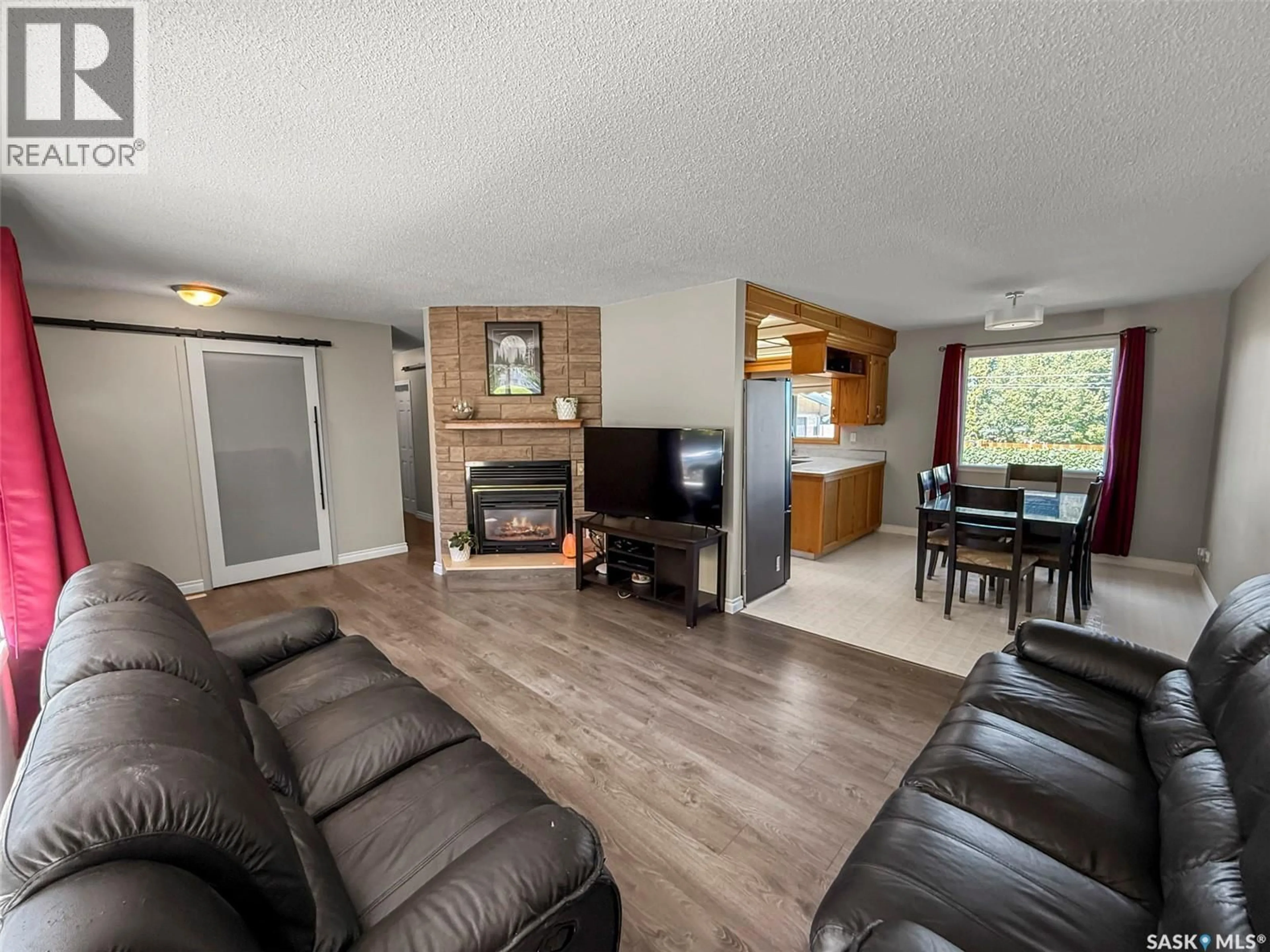 Living room with furniture, wood/laminate floor for 343 ALDER PLACE, Swift Current Saskatchewan S9H3E5