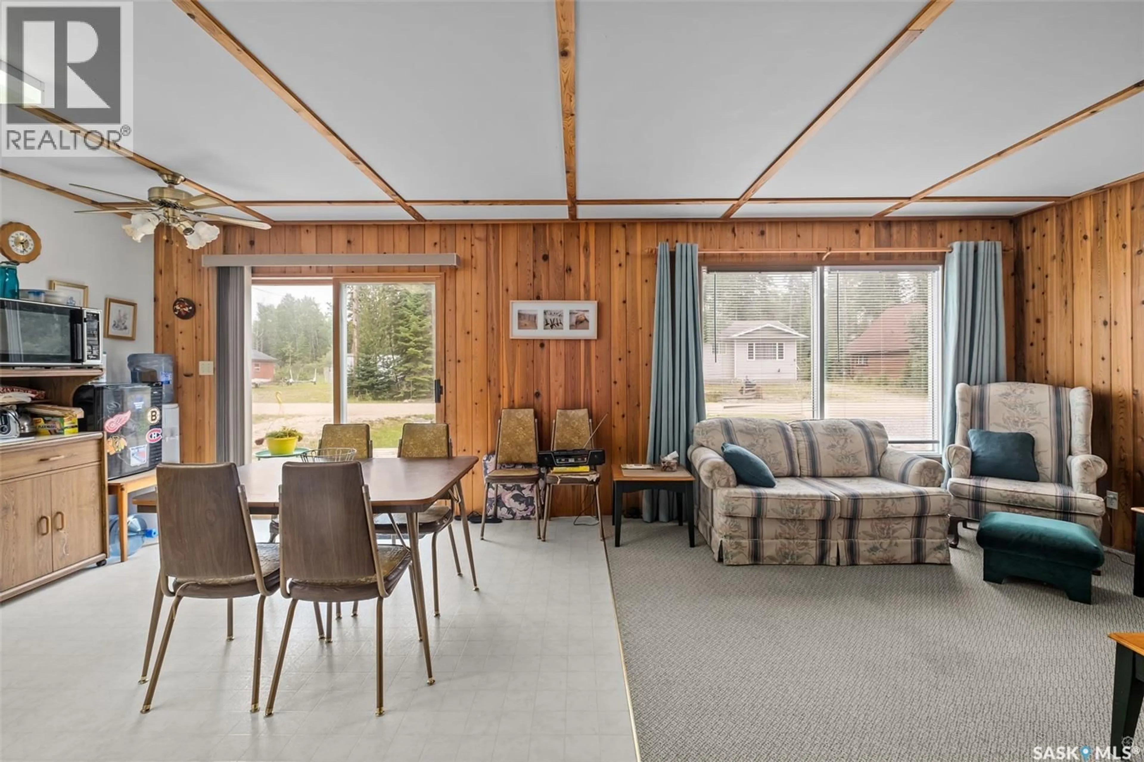 Living room with furniture, wood/laminate floor for 7 TYE PLACE, Candle Lake Saskatchewan S0J3E0