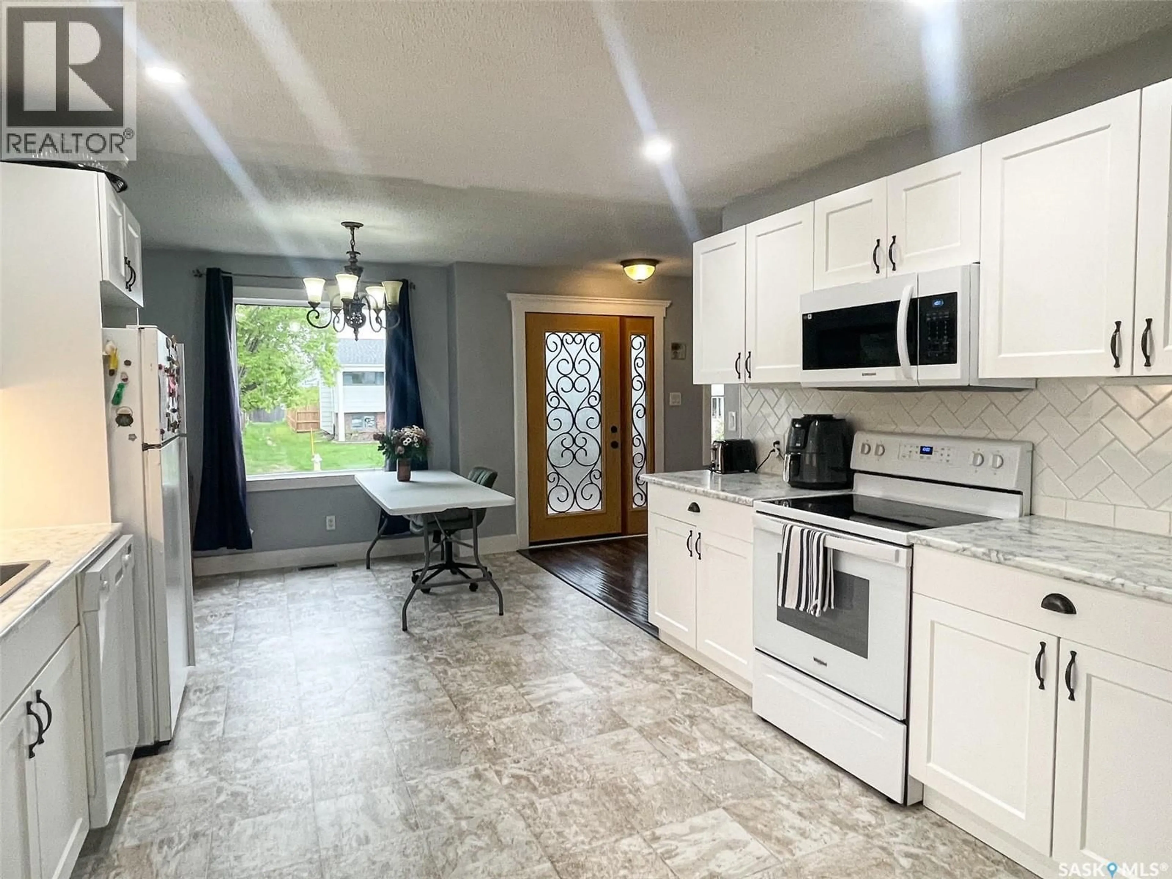 Open concept kitchen, ceramic/tile floor for 67 DUNFIELD CRESCENT, Meadow Lake Saskatchewan S9X1C4