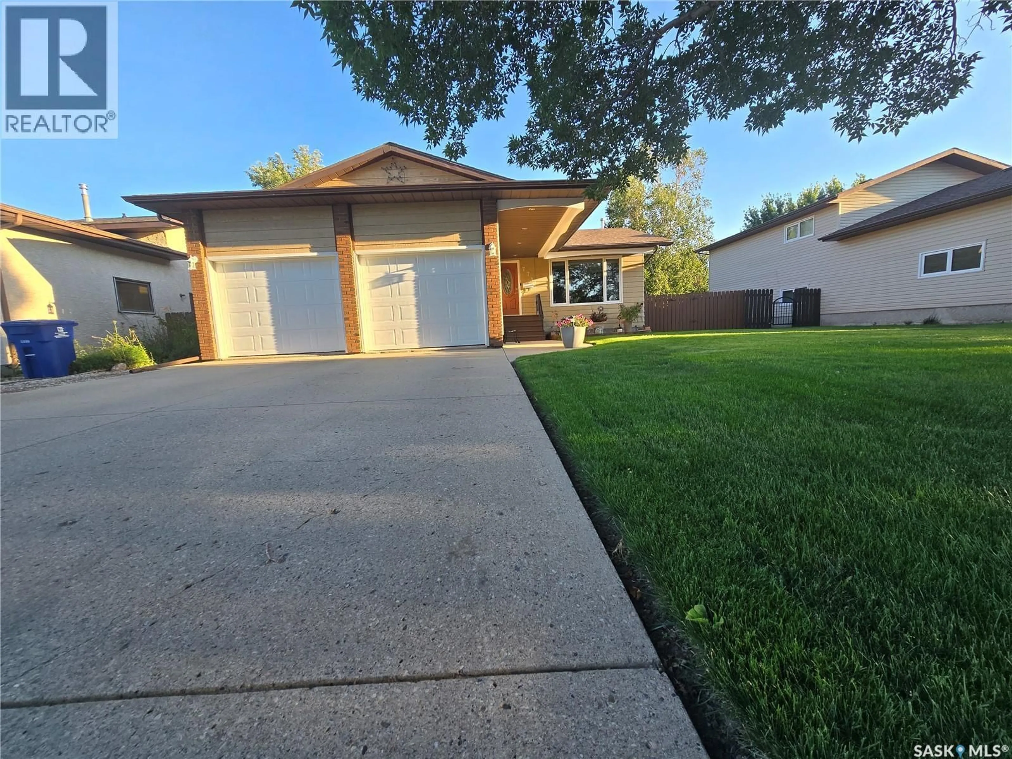 Home with vinyl exterior material, street for 771 BRIMACOMBE DRIVE, Weyburn Saskatchewan S4H2P7