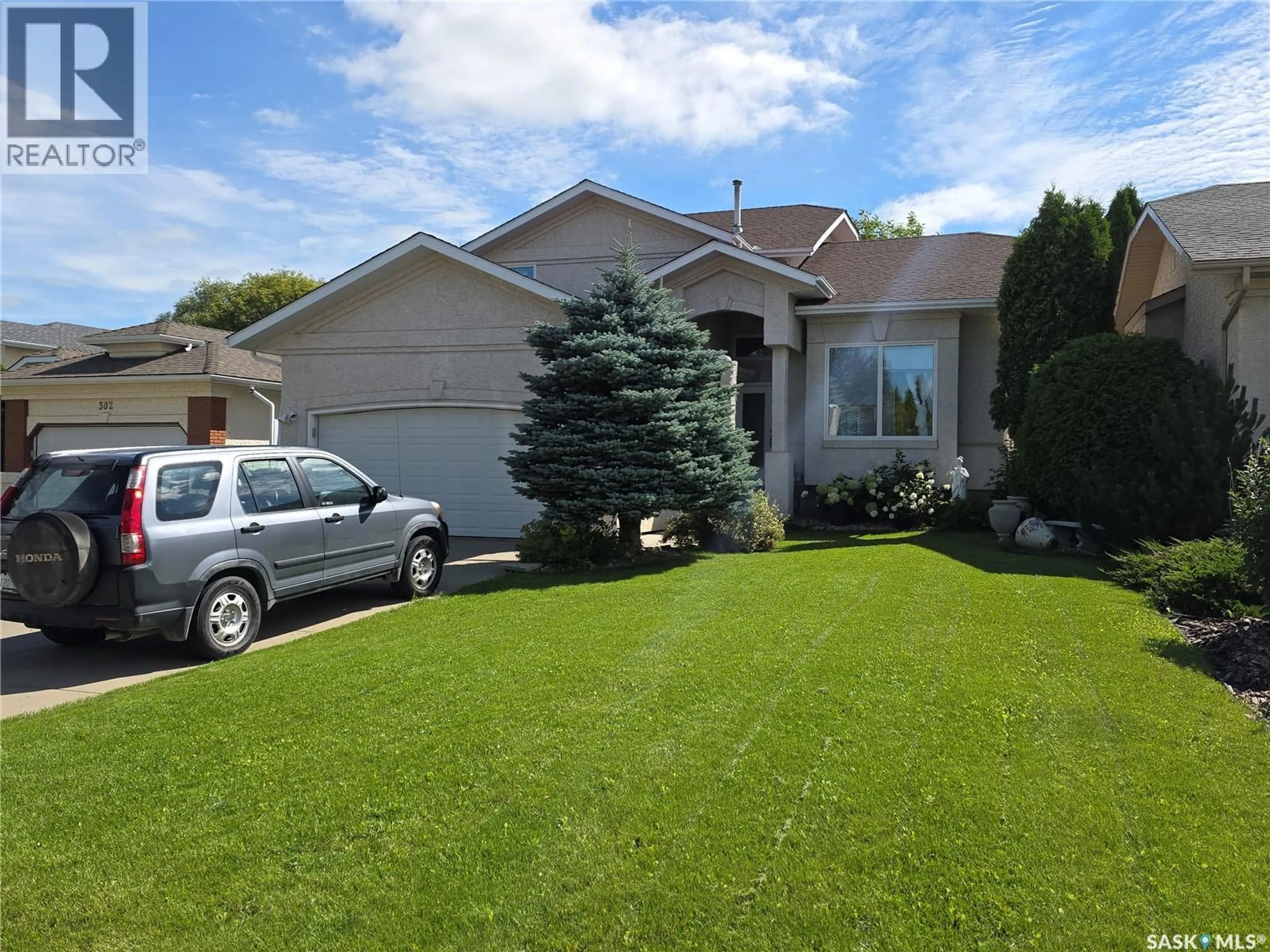 Home with vinyl exterior material, street for 306 BLACKTHORN CRESCENT, Saskatoon Saskatchewan S7V1B1