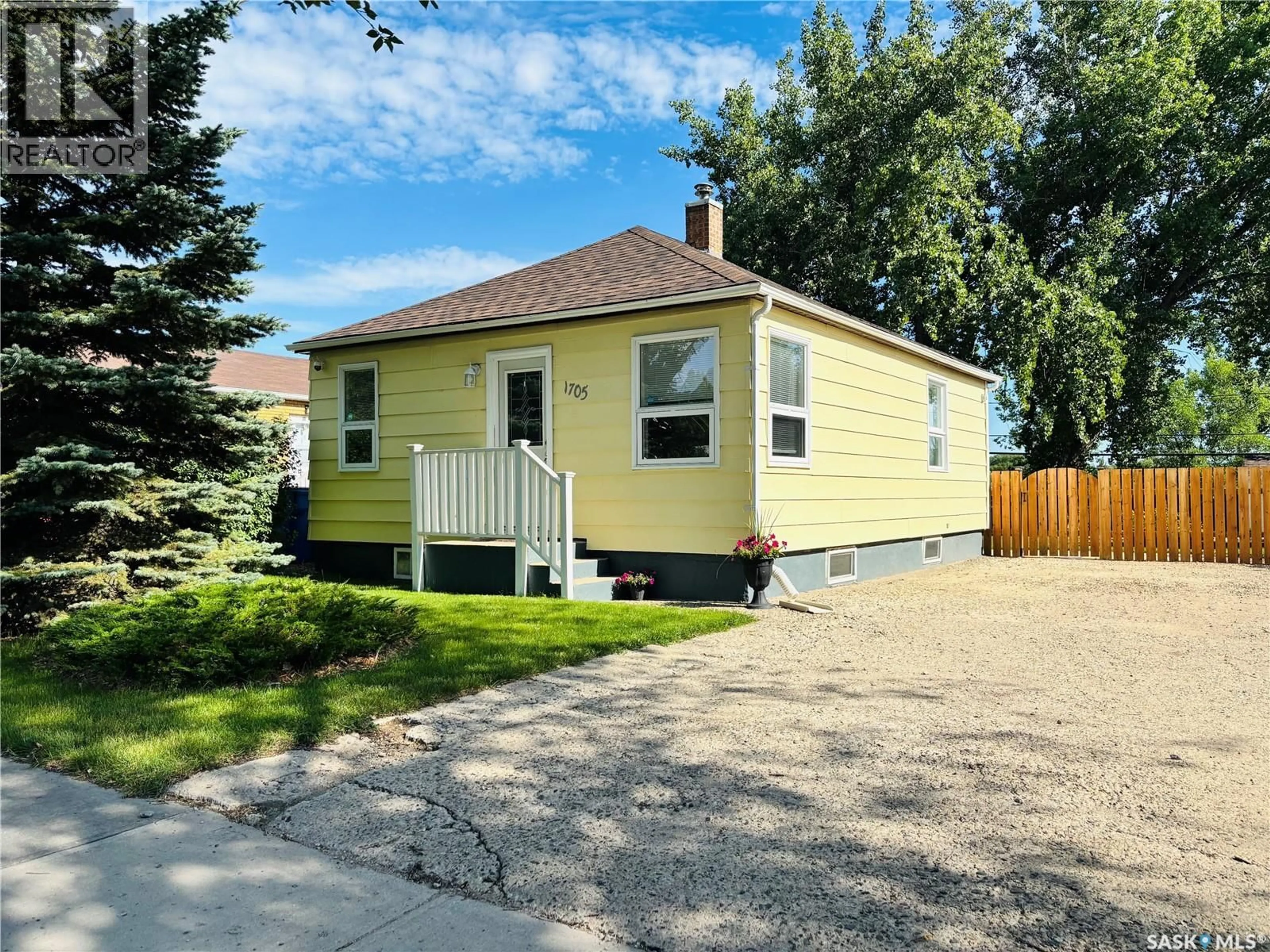 Home with vinyl exterior material, street for 1705 THIRD STREET, Estevan Saskatchewan S4A0S9