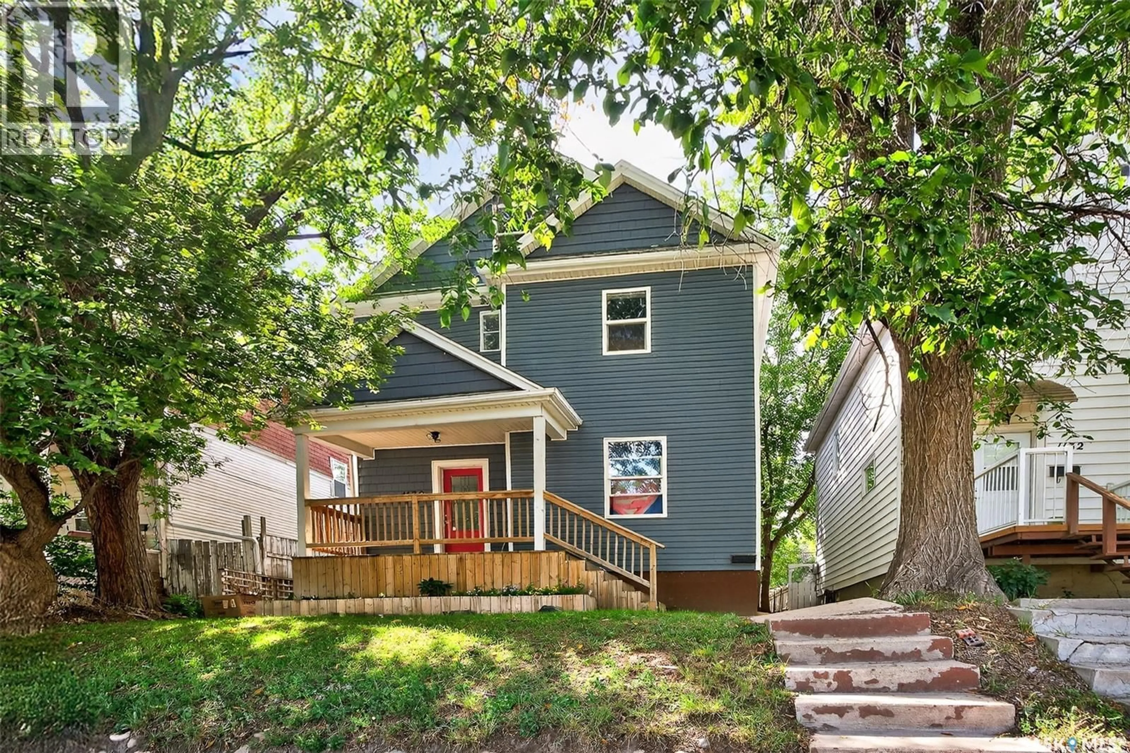 Home with vinyl exterior material, street for 1130 MAIN STREET, Moose Jaw Saskatchewan S6H3K9