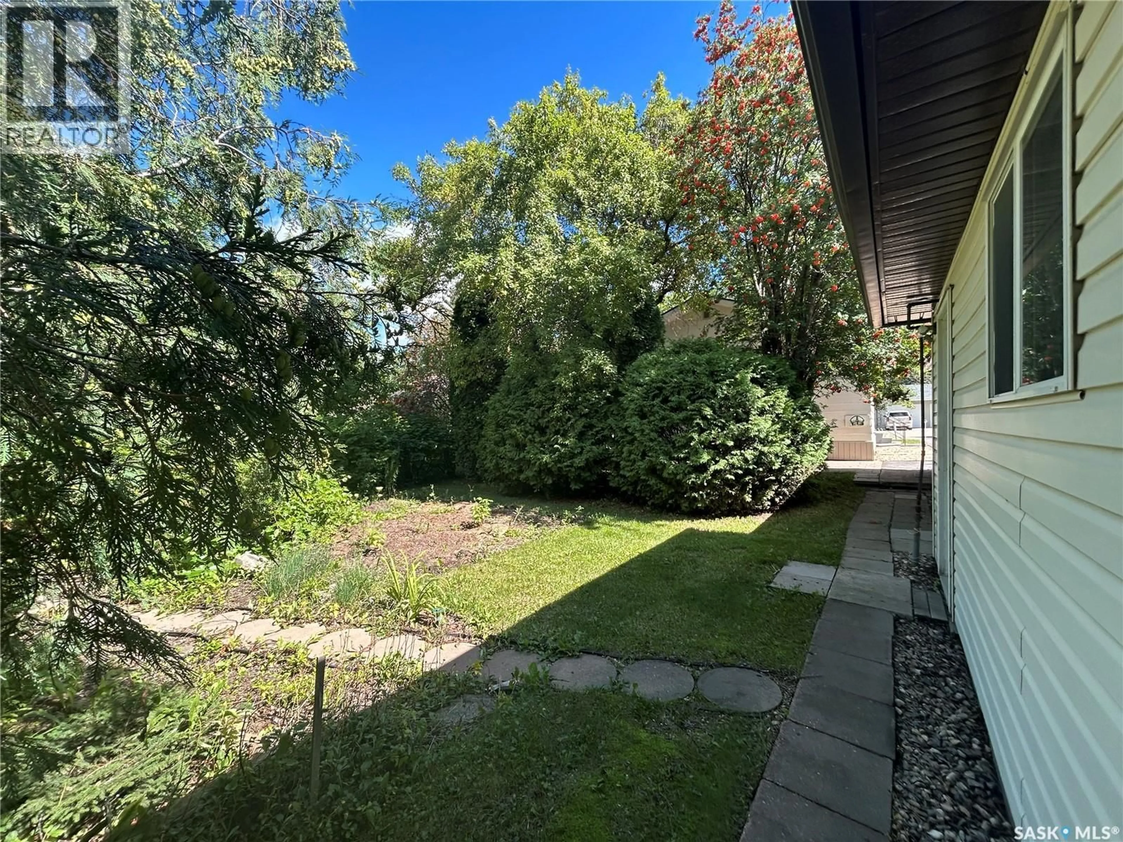 A pic from outside/outdoor area/front of a property/back of a property/a pic from drone, forest/trees view for 1991 NEWMARKET DRIVE, Tisdale Saskatchewan S0E1T0
