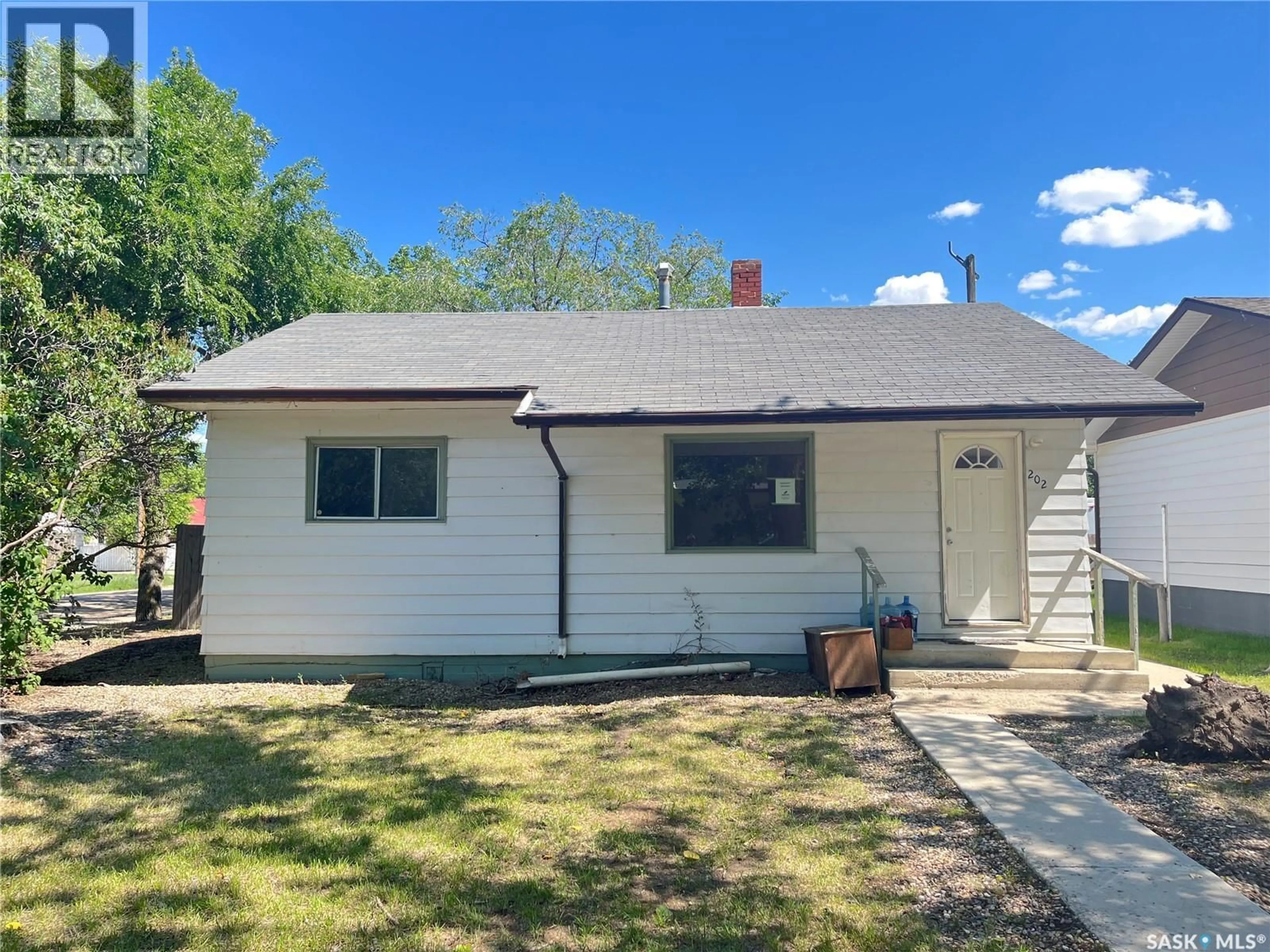 Home with vinyl exterior material, street for 202 MARSH STREET, Maple Creek Saskatchewan S0N1N0