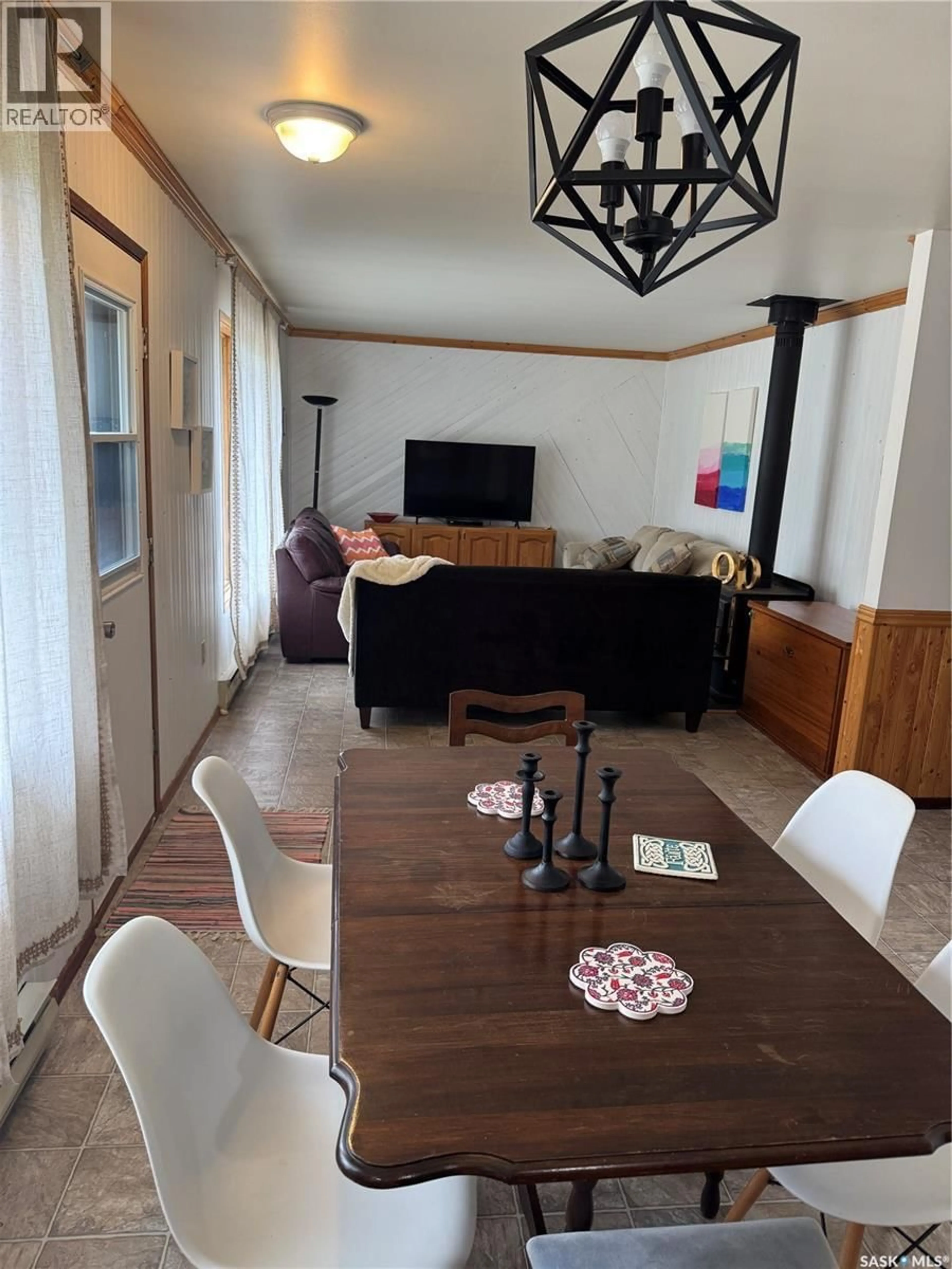 Living room with furniture, wood/laminate floor for 808 POTTER CRESCENT, Good Spirit Lake Saskatchewan S0A0L0