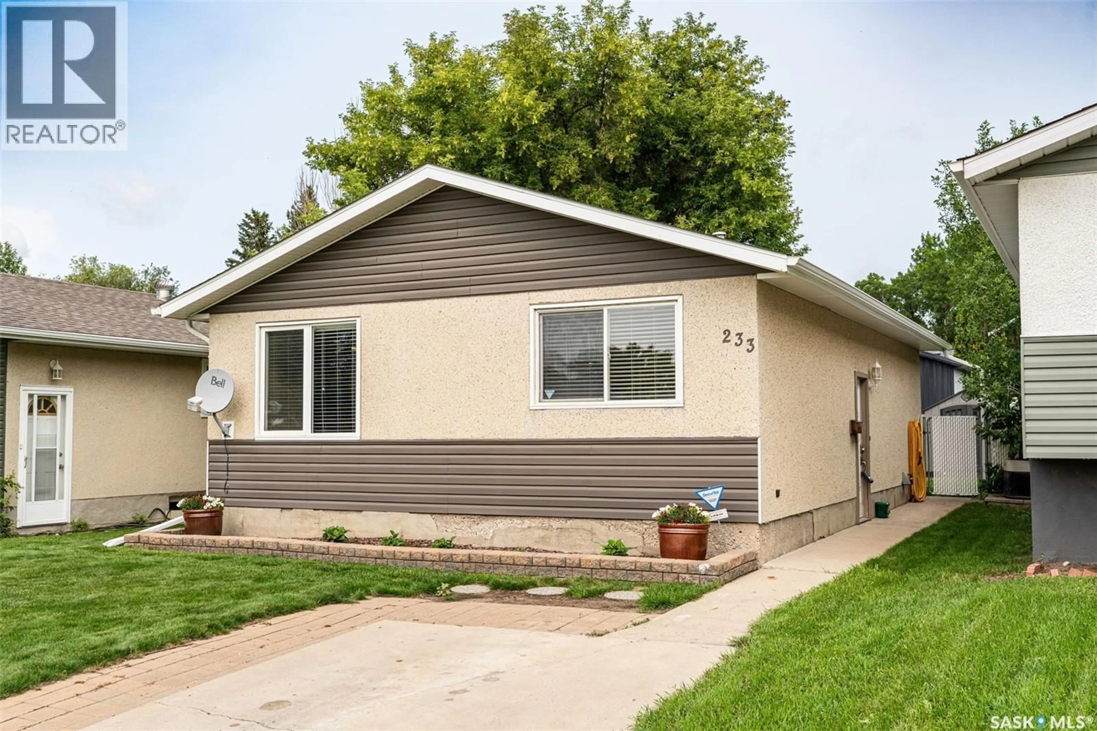 Home with vinyl exterior material, street for 233 BOYCHUK DRIVE, Saskatoon Saskatchewan S7H4C8