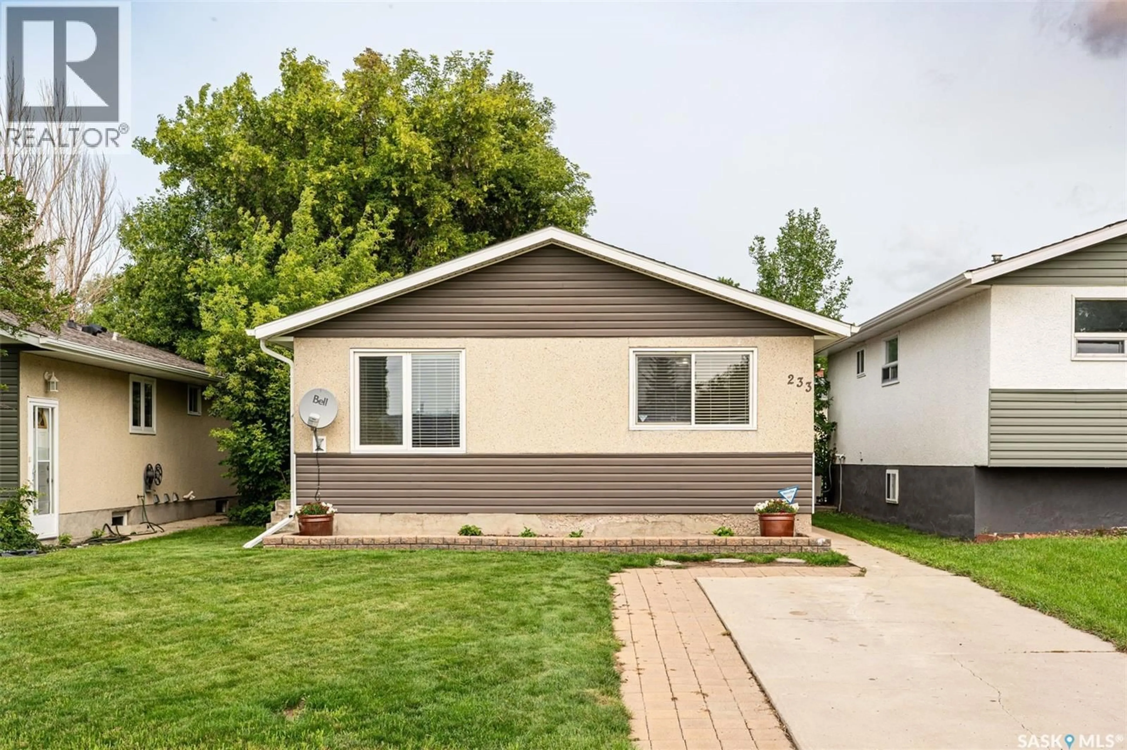 Home with vinyl exterior material, street for 233 BOYCHUK DRIVE, Saskatoon Saskatchewan S7H4C8