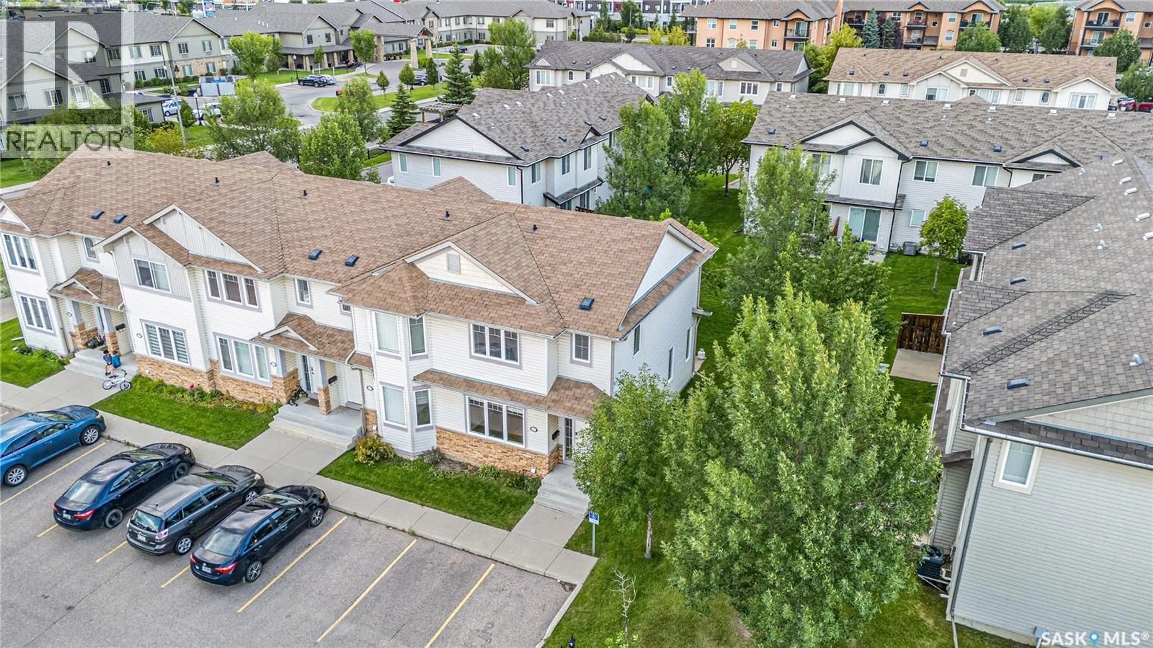 A pic from outside/outdoor area/front of a property/back of a property/a pic from drone, unknown for 213 415 LYND CRESCENT, Saskatoon Saskatchewan S7T0C2