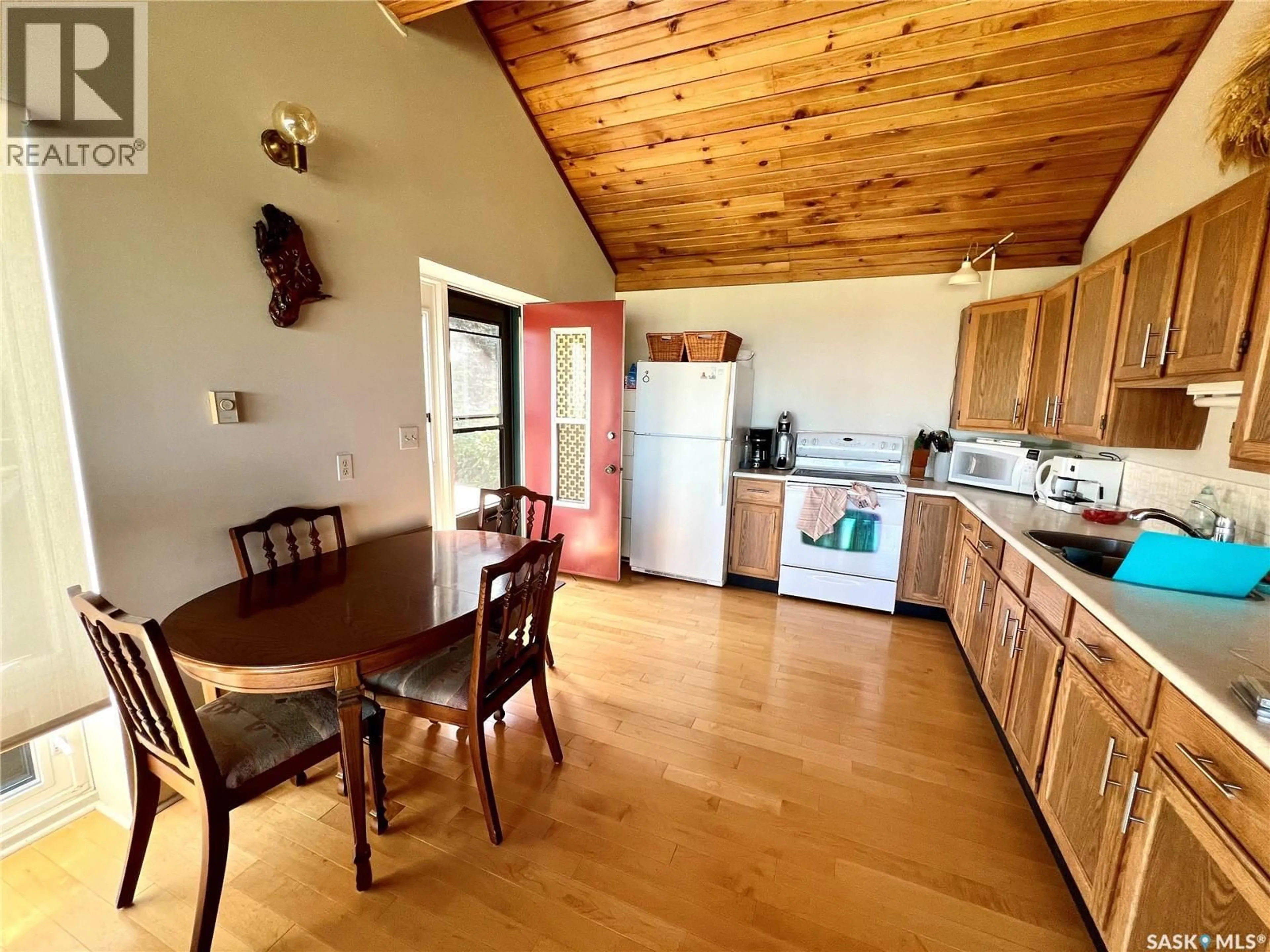 Open concept kitchen, wood/laminate floor for 65 SARGEANT DRIVE, Diefenbaker Lake Saskatchewan S0H3P0