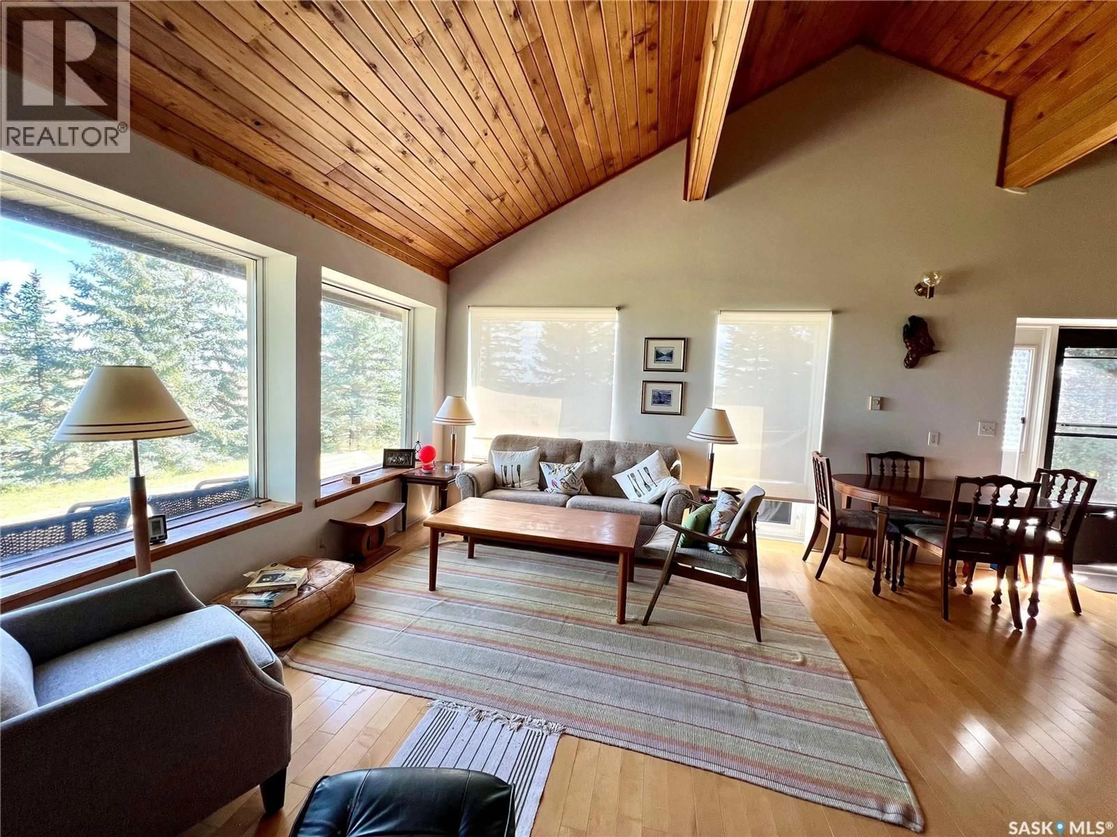 Living room with furniture, wood/laminate floor for 65 SARGEANT DRIVE, Diefenbaker Lake Saskatchewan S0H3P0