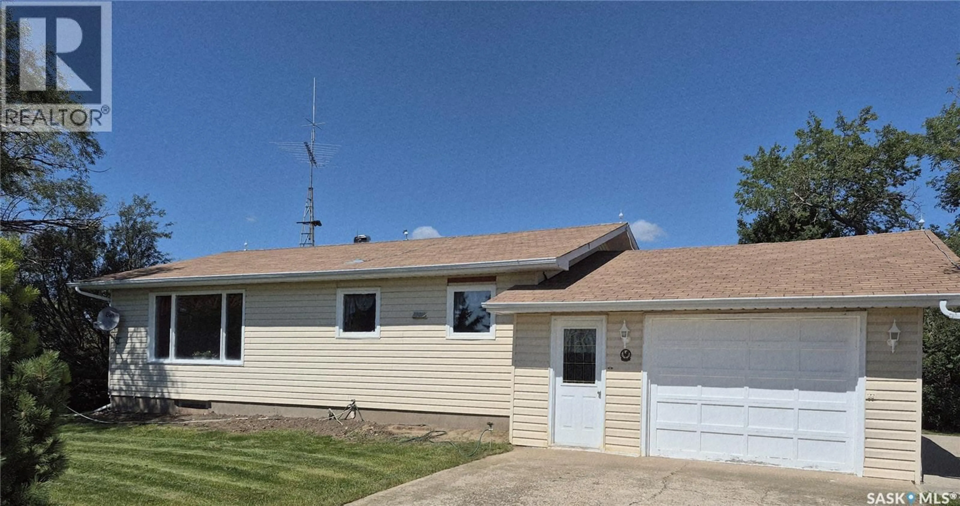 Home with vinyl exterior material, street for GADER ACREAGE, Coulee Rm No. 136 Saskatchewan S0N1M0