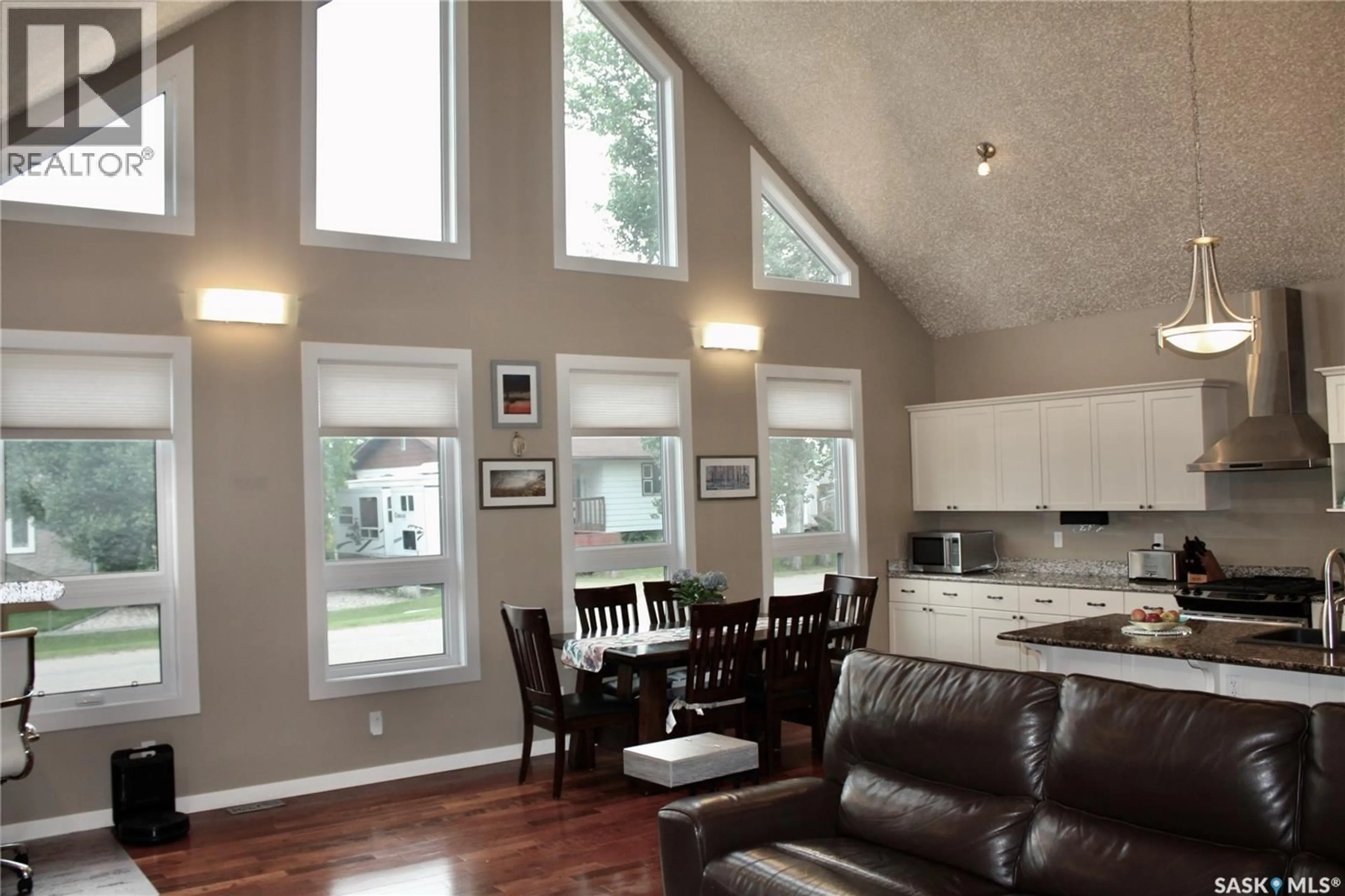 Open concept kitchen, wood/laminate floor for 212 JURA STREET, Colonsay Saskatchewan S0K0Z0