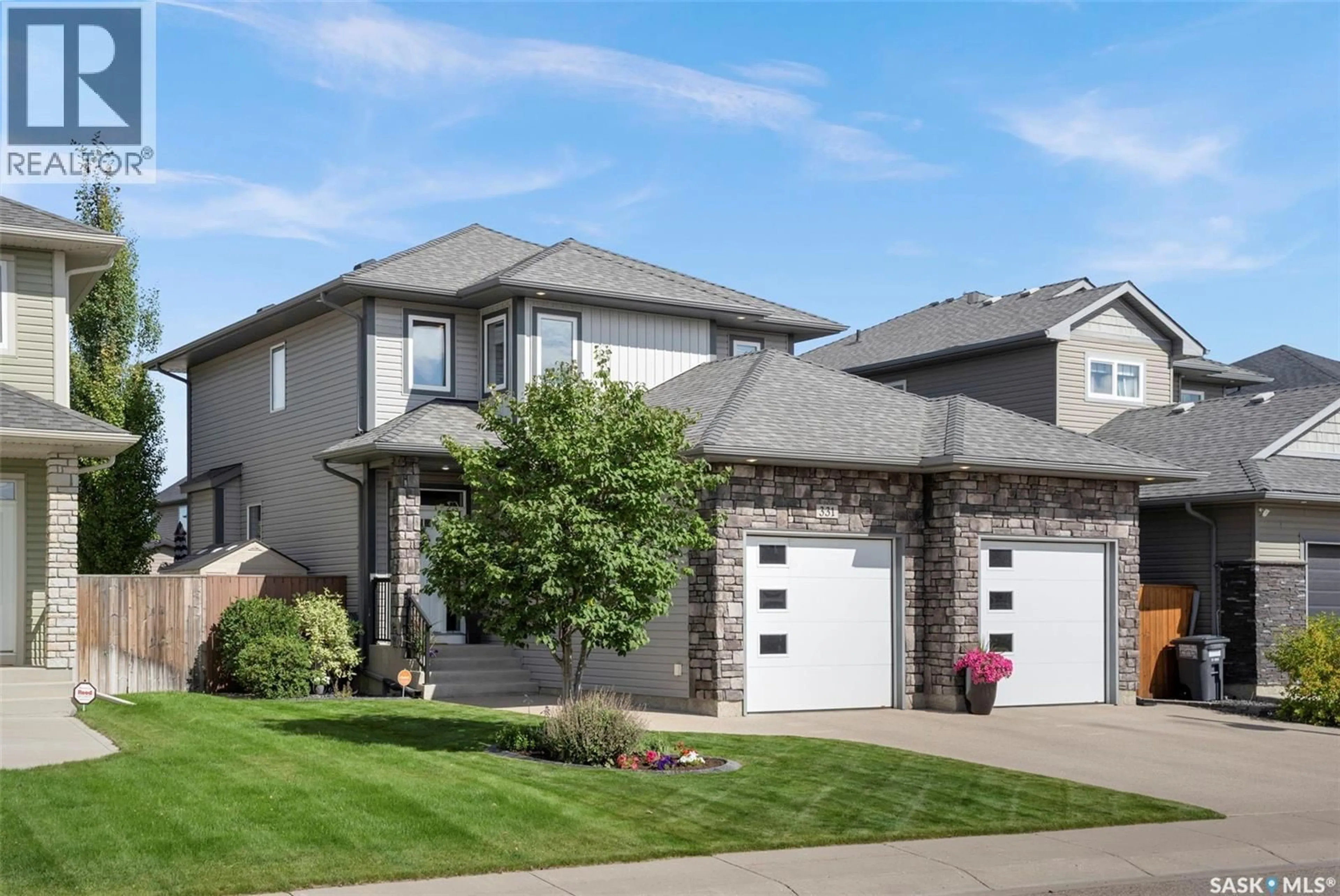 Home with vinyl exterior material, street for 331 LANGLOIS WAY, Saskatoon Saskatchewan S7T0M9