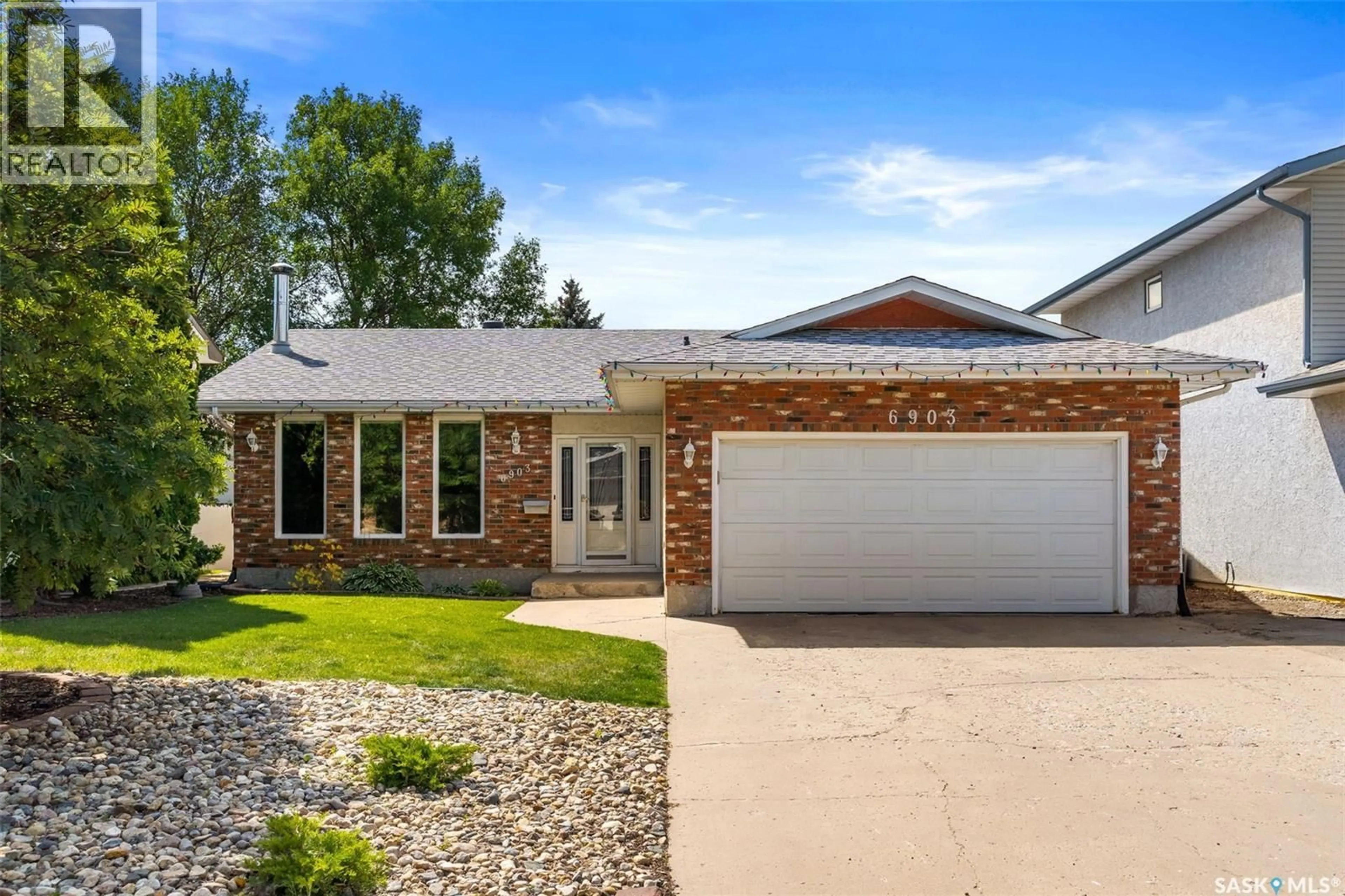Home with brick exterior material, street for 6903 SHERWOOD DRIVE, Regina Saskatchewan S4X1C2