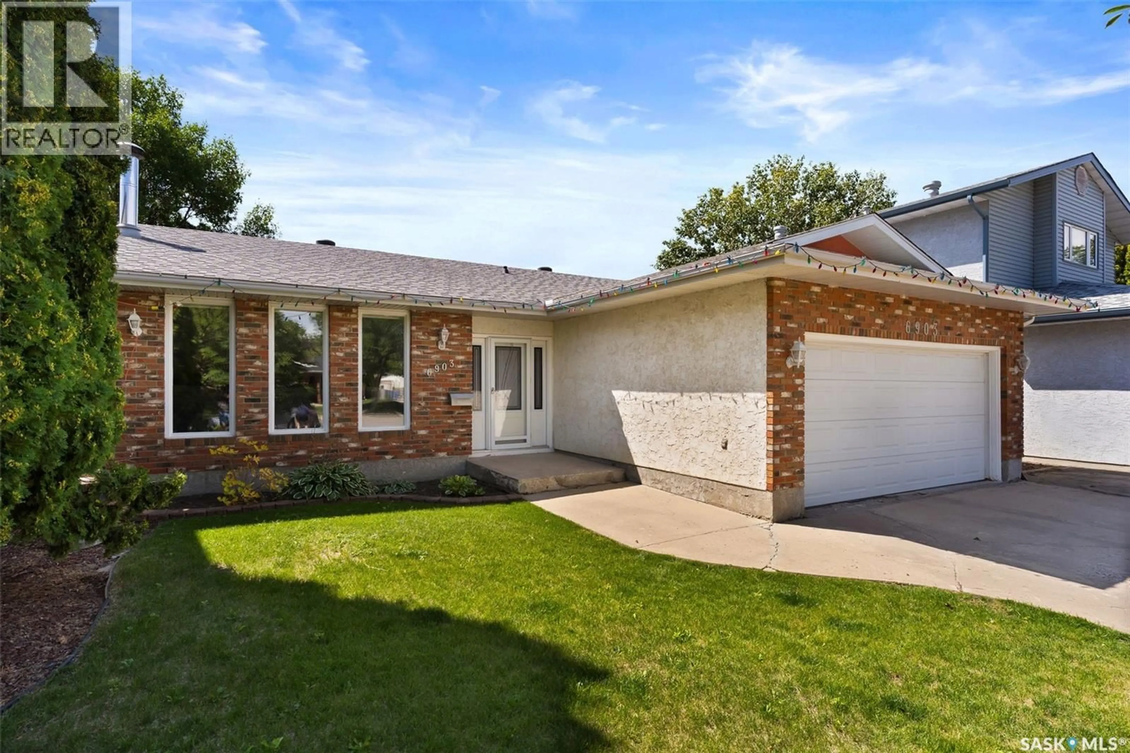 Home with brick exterior material, street for 6903 SHERWOOD DRIVE, Regina Saskatchewan S4X1C2