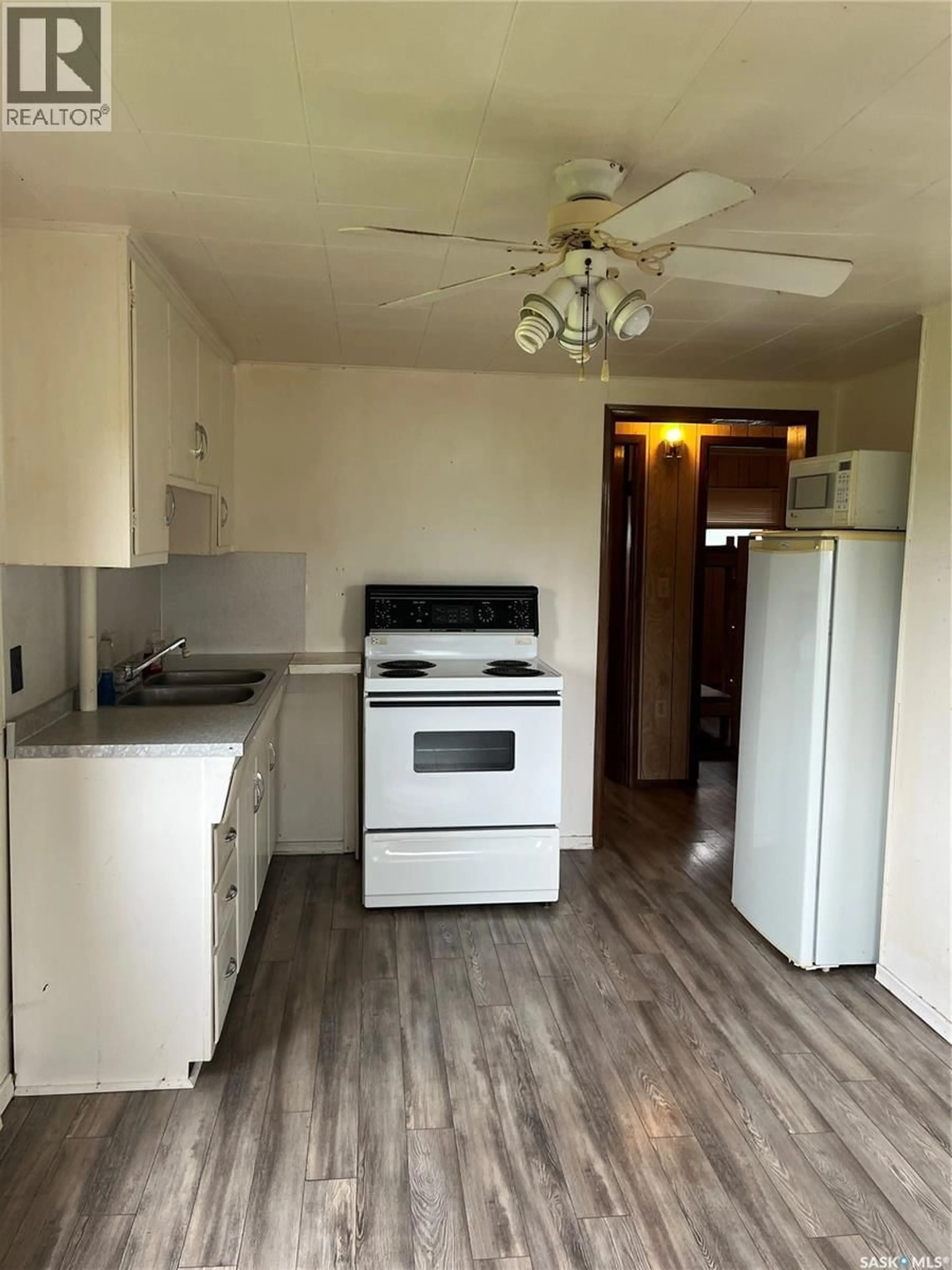 Standard kitchen, wood/laminate floor for 132 SECOND AVENUE, Calder Saskatchewan S0A0K0