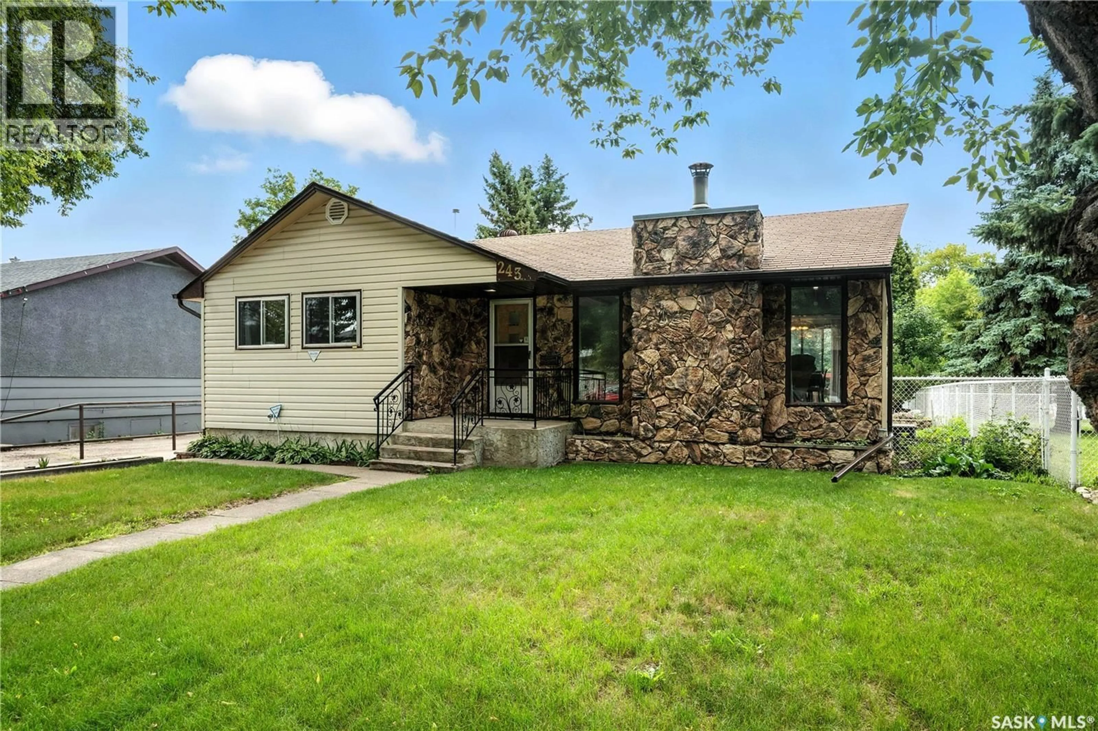 Home with vinyl exterior material, street for 243 25TH STREET, Prince Albert Saskatchewan S6V4P4