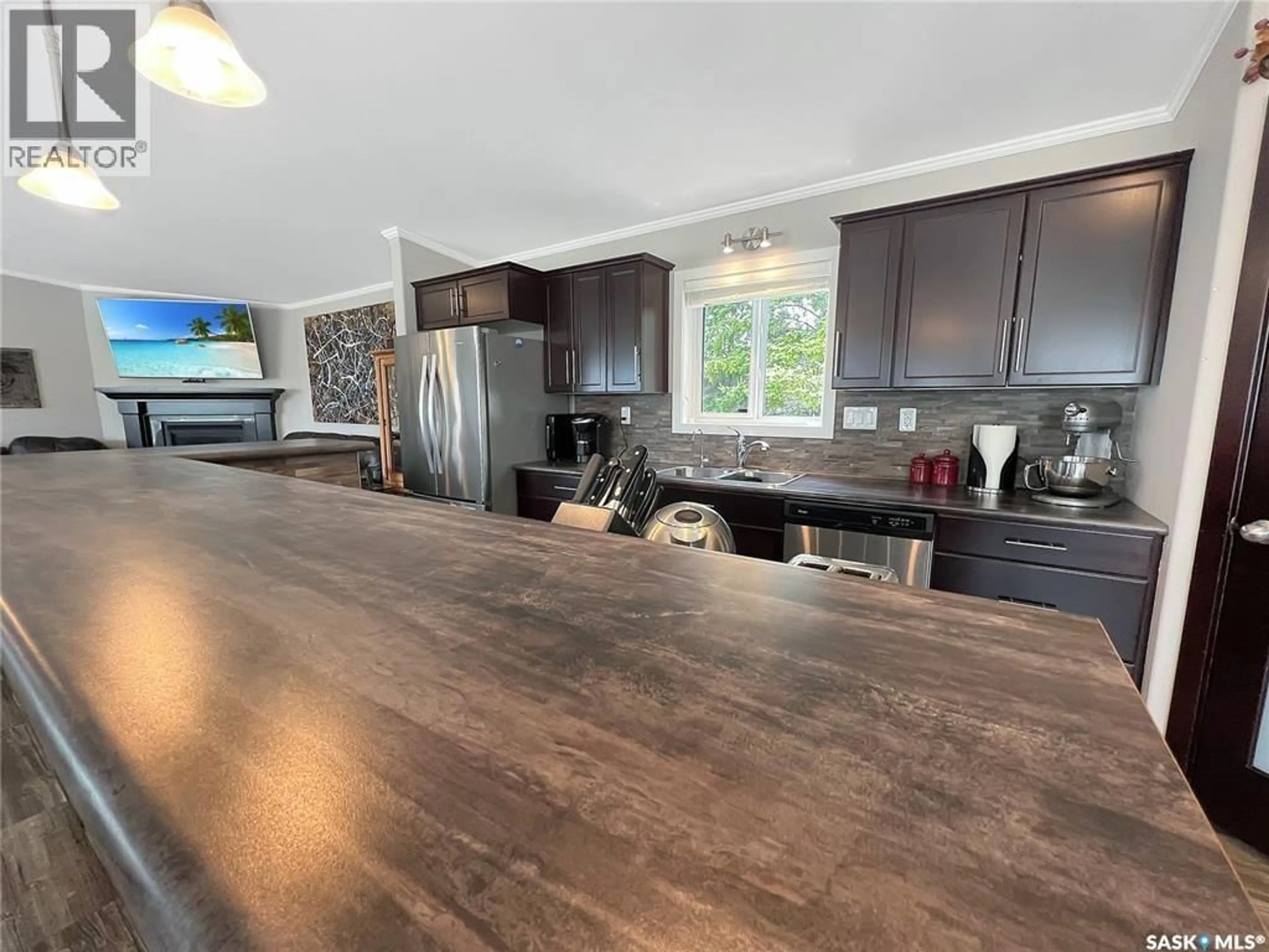 Open concept kitchen, wood/laminate floor for 4 PINE DRIVE, Candle Lake Saskatchewan S0J3E0