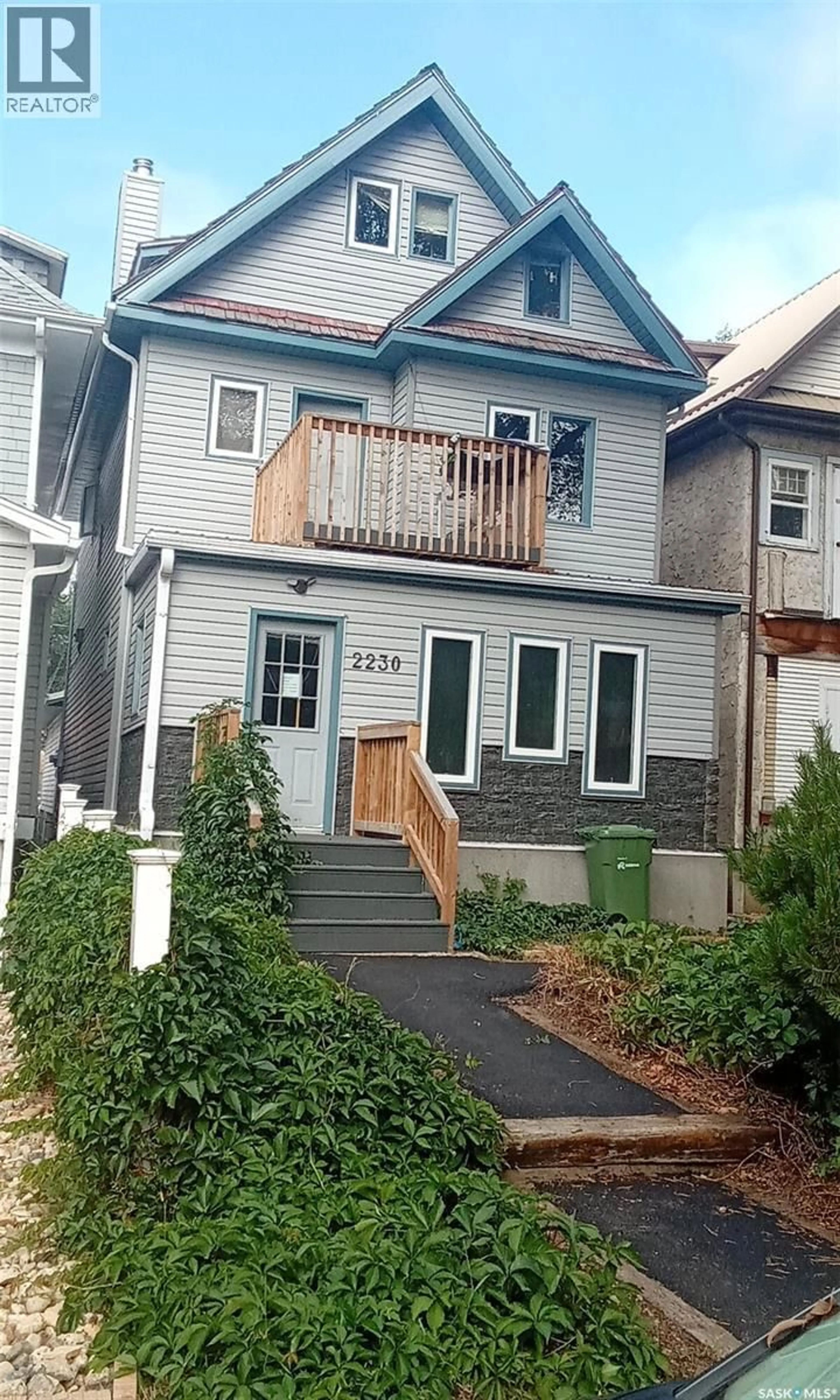 Home with vinyl exterior material, street for 2230 RETALLACK STREET, Regina Saskatchewan S4T0C7