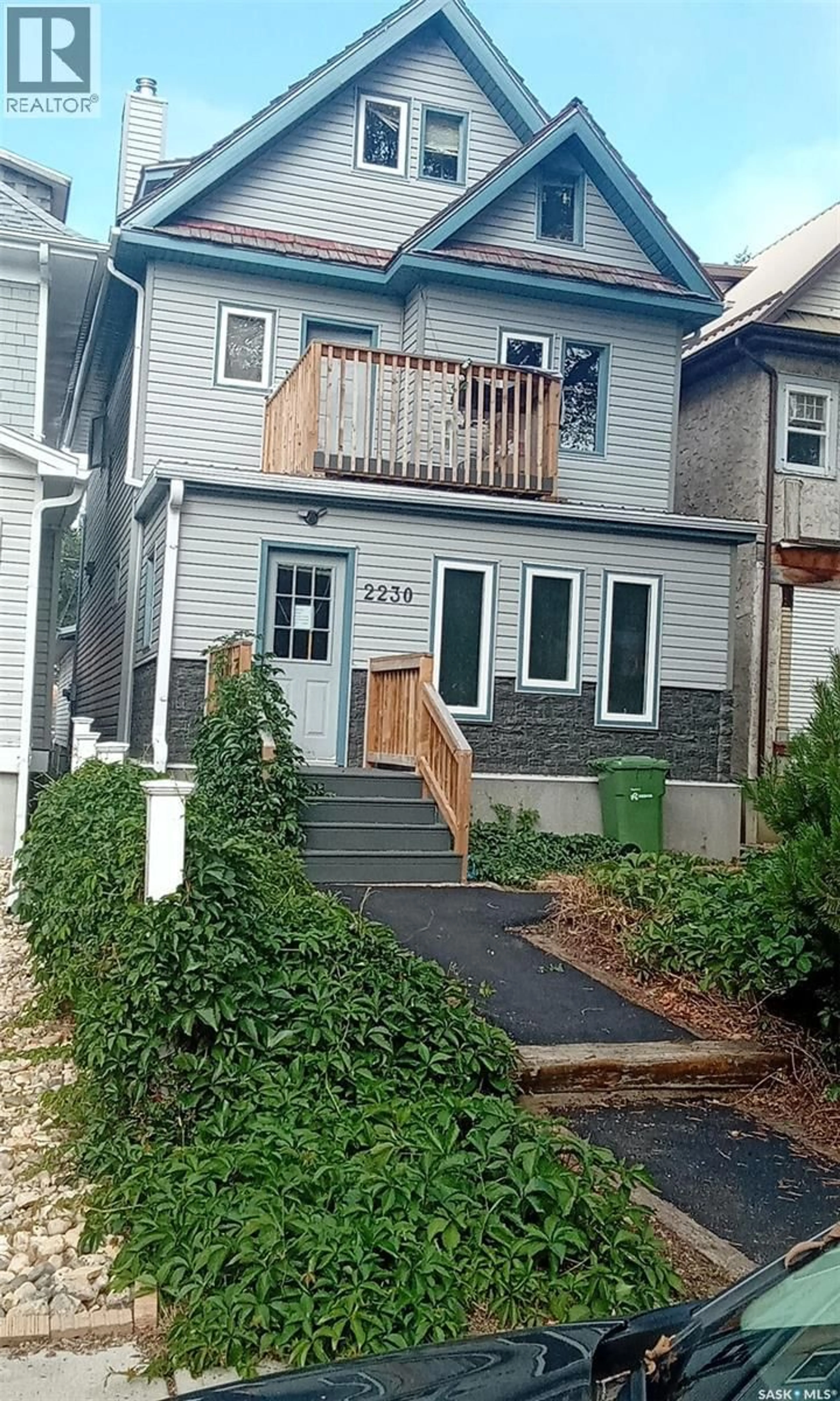 Home with vinyl exterior material, street for 2230 RETALLACK STREET, Regina Saskatchewan S4T0C7